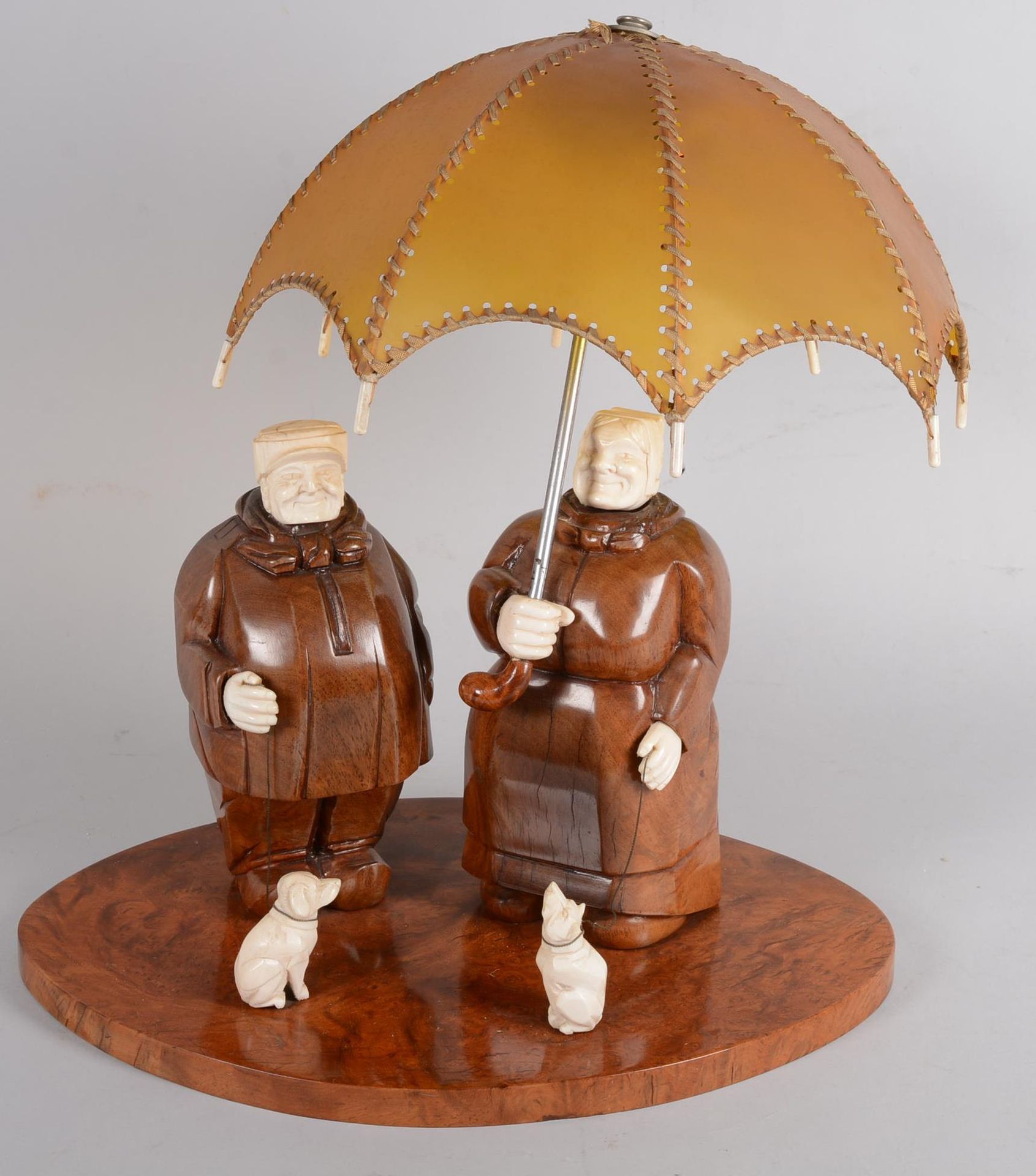 Null Lamp with characters and dogs under an umbrella, carved wood and ivory, wor&hellip;