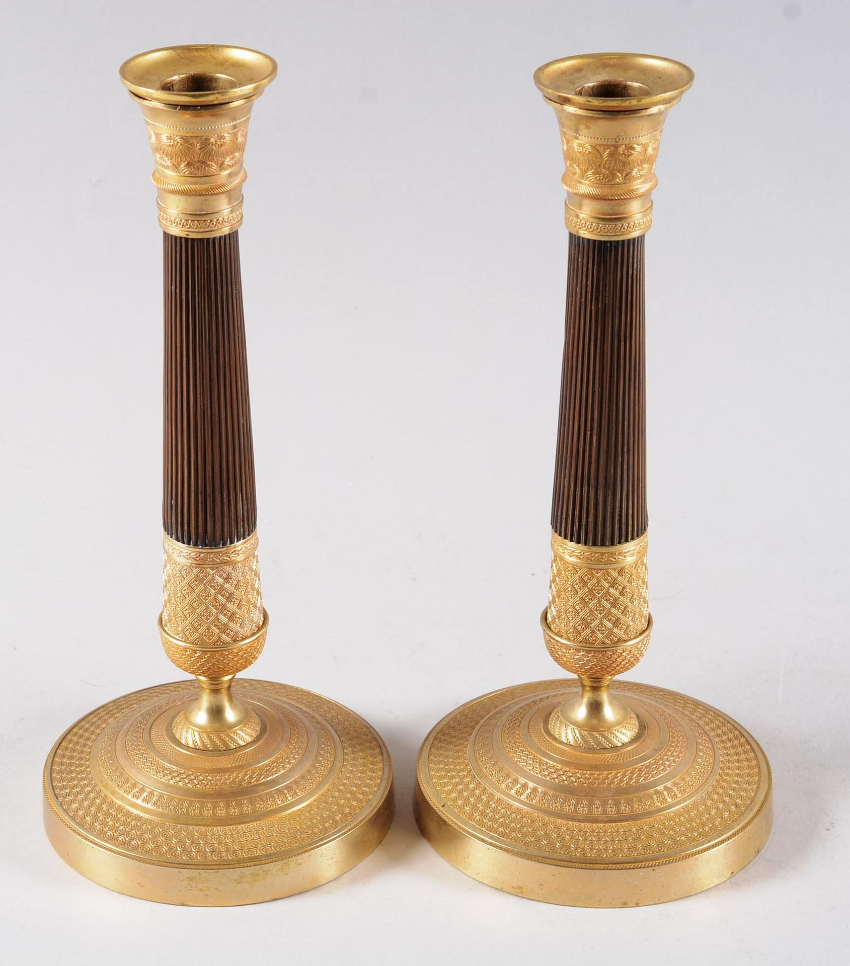 Paire de flambeaux A pair of ormolu and patinated torches, chiselled binet, roun&hellip;