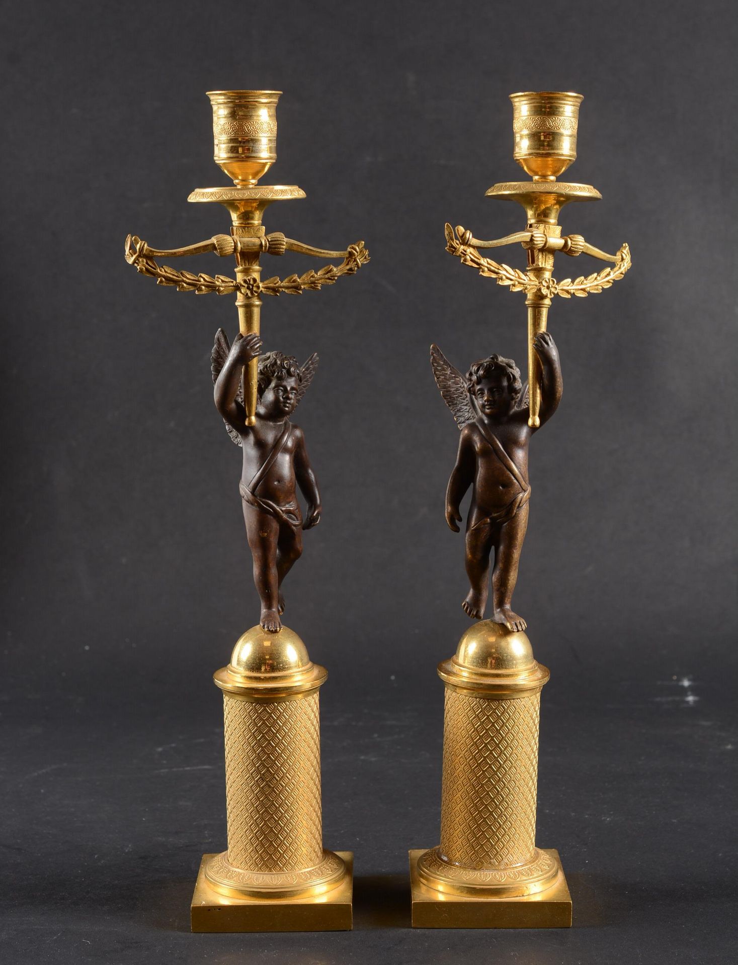 Paire de flabeaux aux angelots A pair of ormolu and patinated torches with winge&hellip;