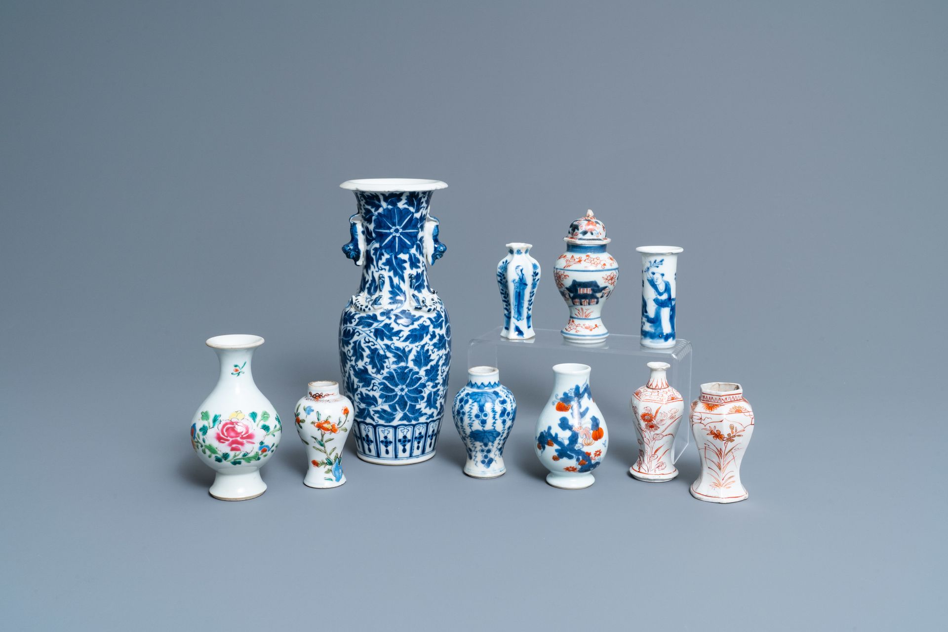 Ten mostly Chinese blue and white, famille rose and Imari-style vases, Kangxi an&hellip;