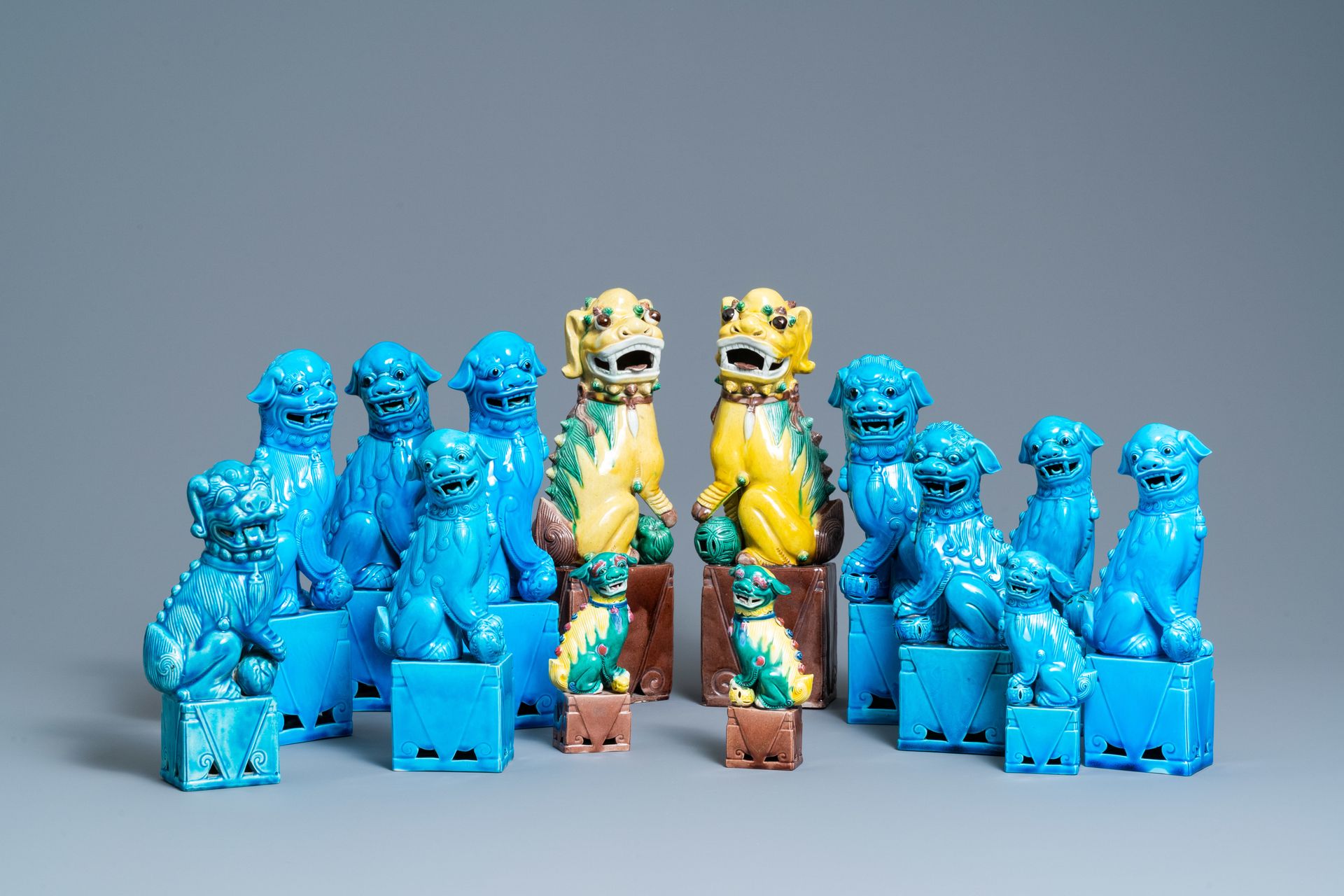 Fourteen Chinese monochrome turquoise and famille verte models of Buddhist lions&hellip;