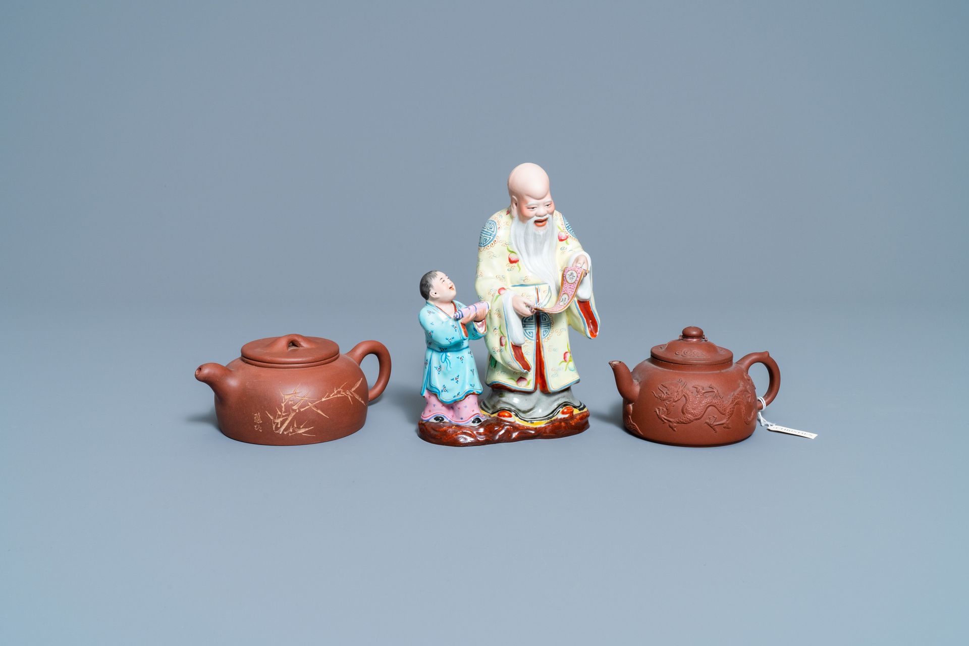 Two Chinese Yixing stoneware teapots and a famille rose 'Shou Lao' group, Kangxi&hellip;
