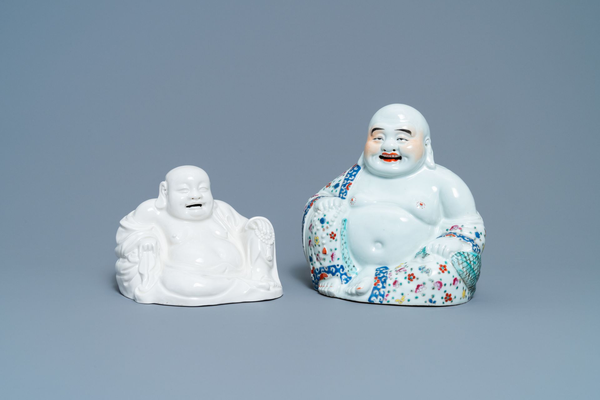 A Chinese famille rose figure of Buddha and one in blanc de Chine, 19/20th C. Fu&hellip;
