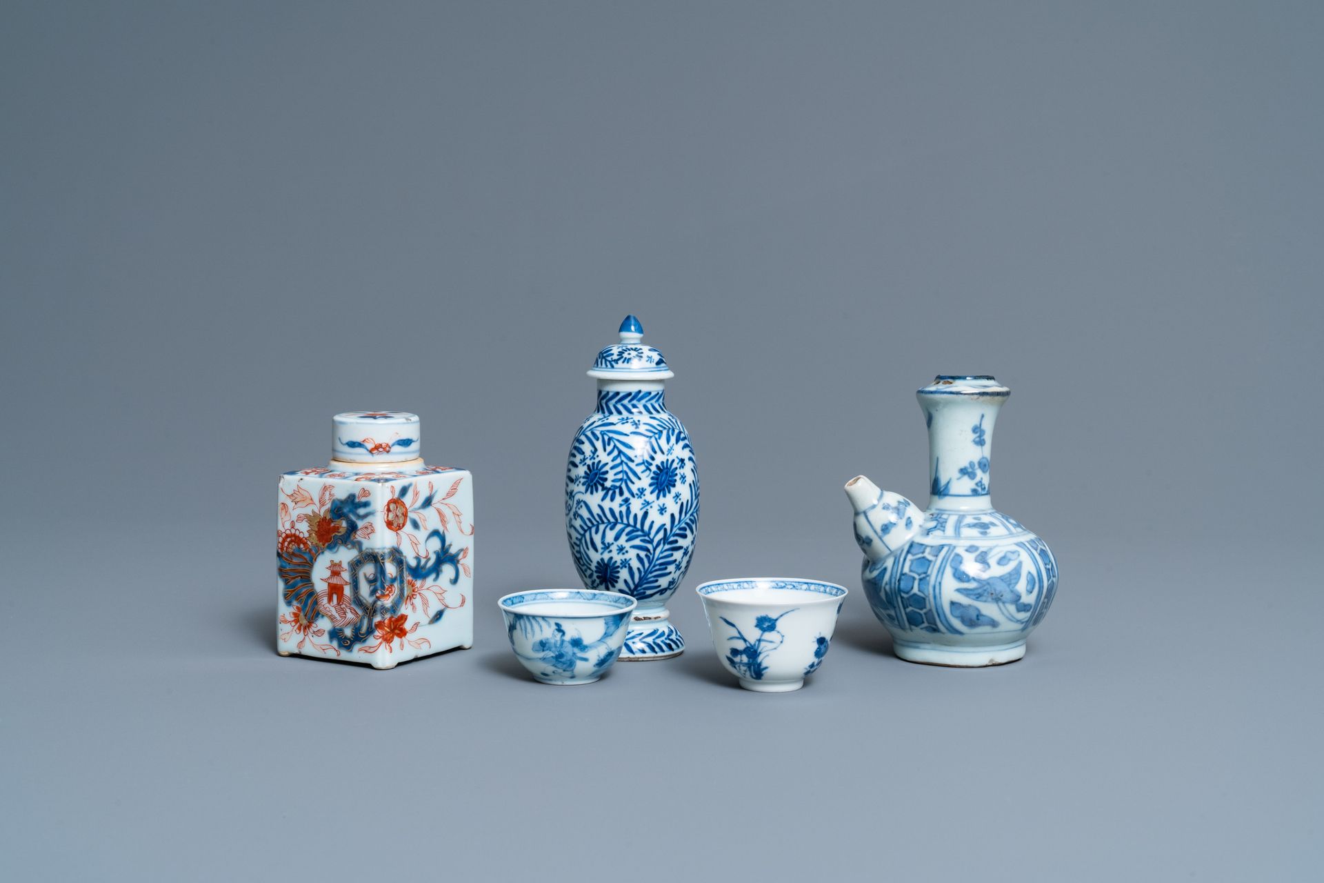 Two Chinese blue and white cups, a covered vase, a kendi and an Imari-style tea &hellip;