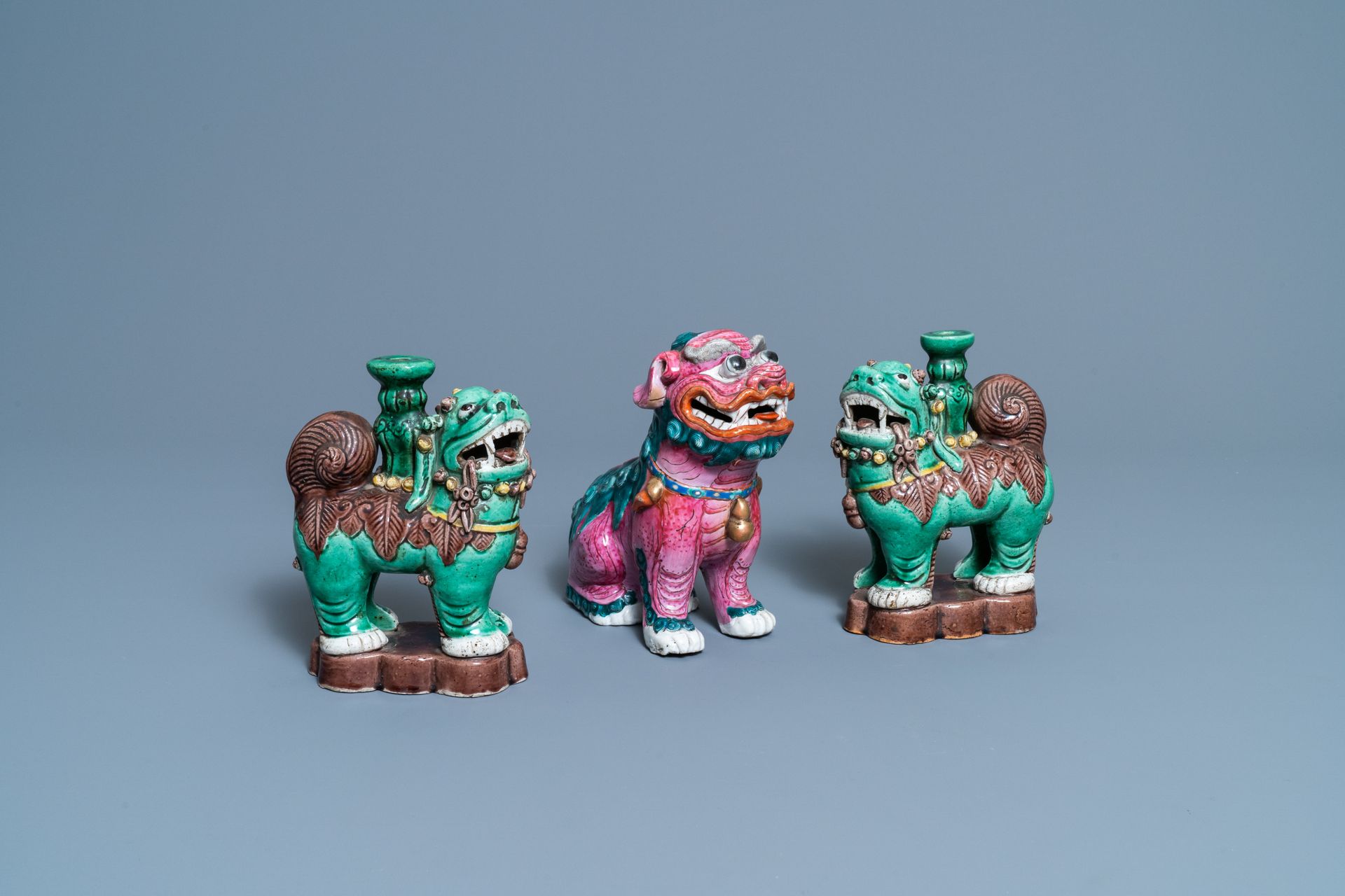 A Chinese famille rose model of a Buddhist lion and a pair of verte biscuit joss&hellip;