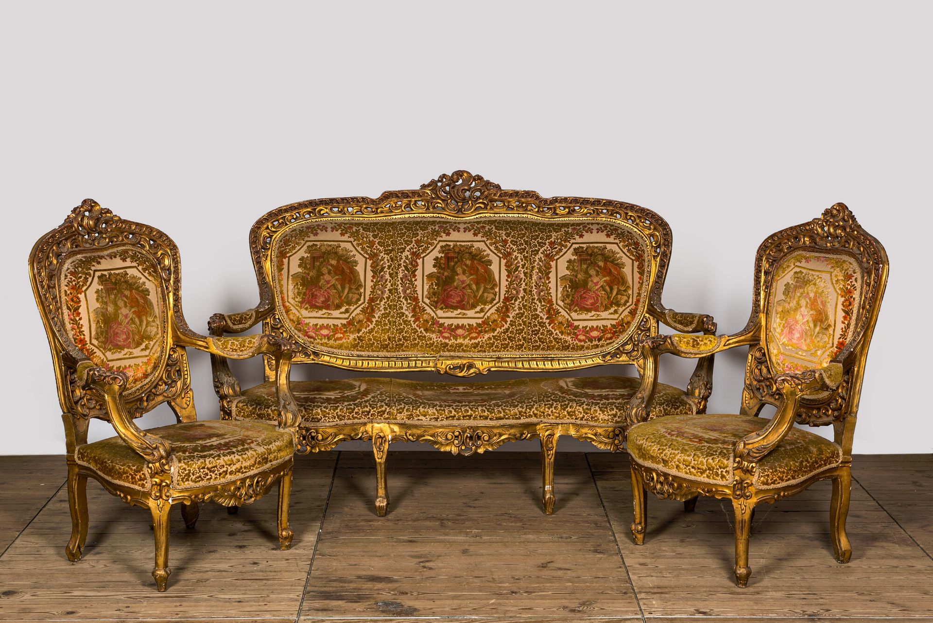 A Louis XV-style gilt wooden salon set comprising a three-seater sofa and two ar&hellip;