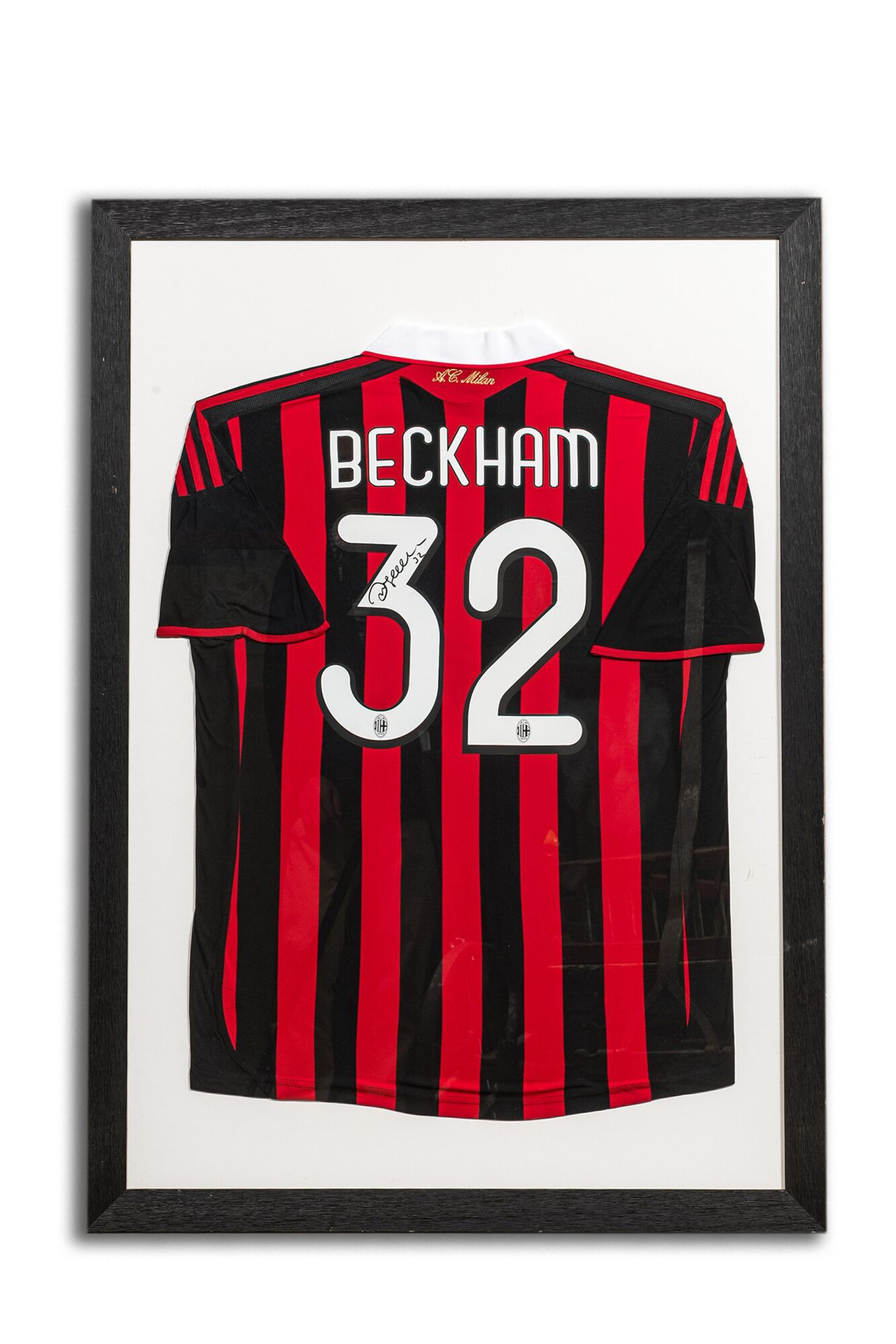 A framed and A.C. Milan football jersey signed by David Beckham Full title: A fr&hellip;