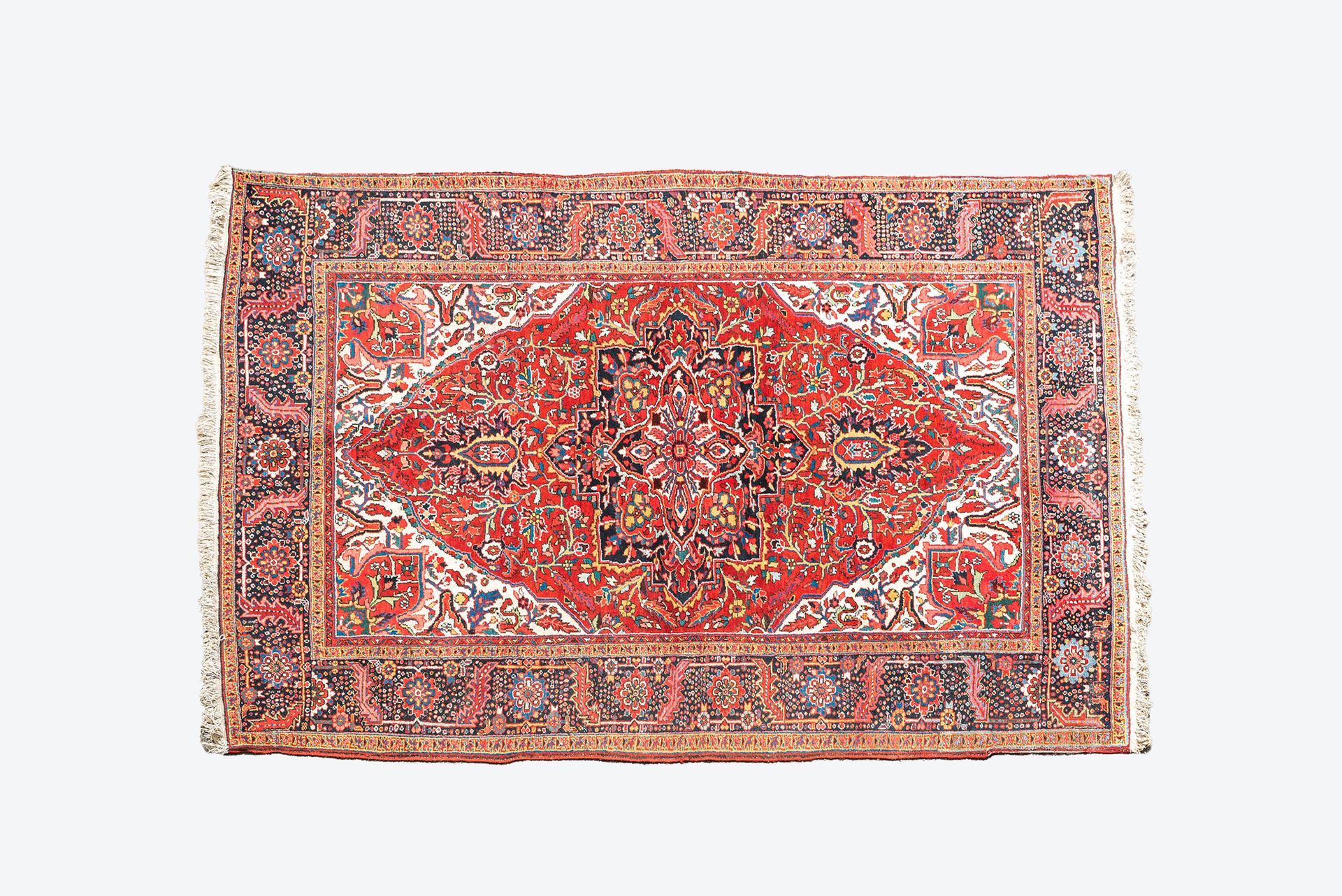 A large rectangular ornamental Heriz rug, 1st half 20th C. Full title: A large r&hellip;