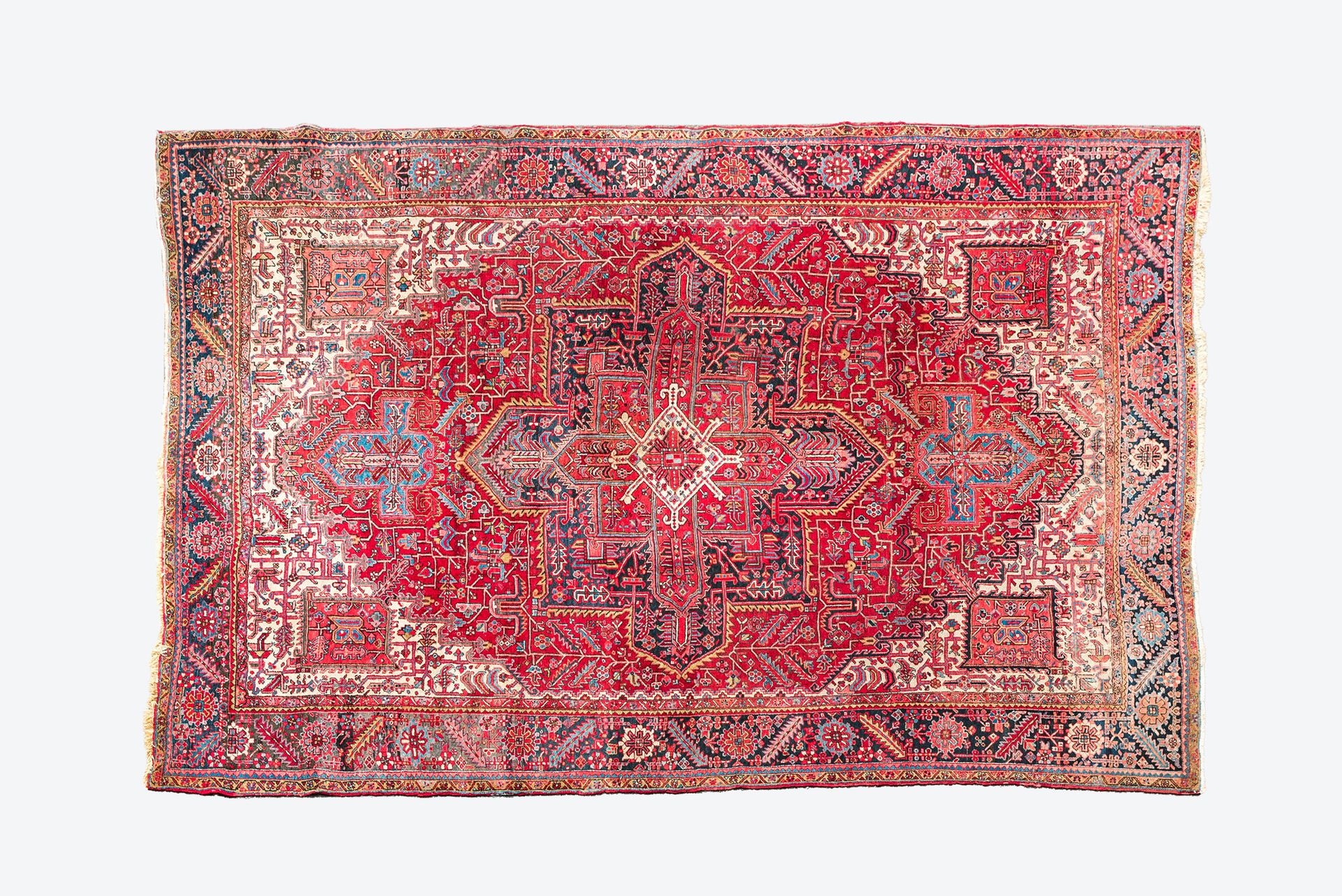 A Persian Heriz rug with floral design and geometric motifs, wool on cotton, 20t&hellip;
