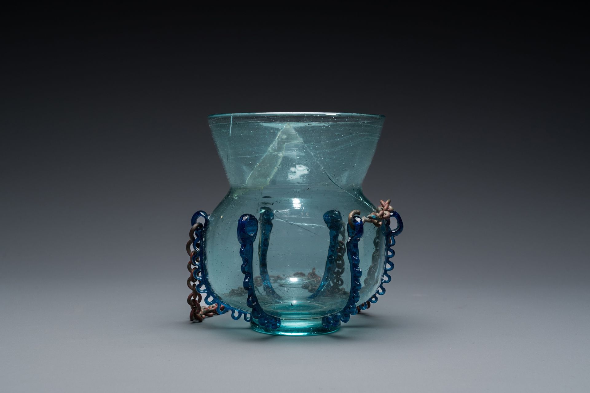 A light blue glass mosque lamp, Syria or Persia, 10th C. Full title: A light blu&hellip;