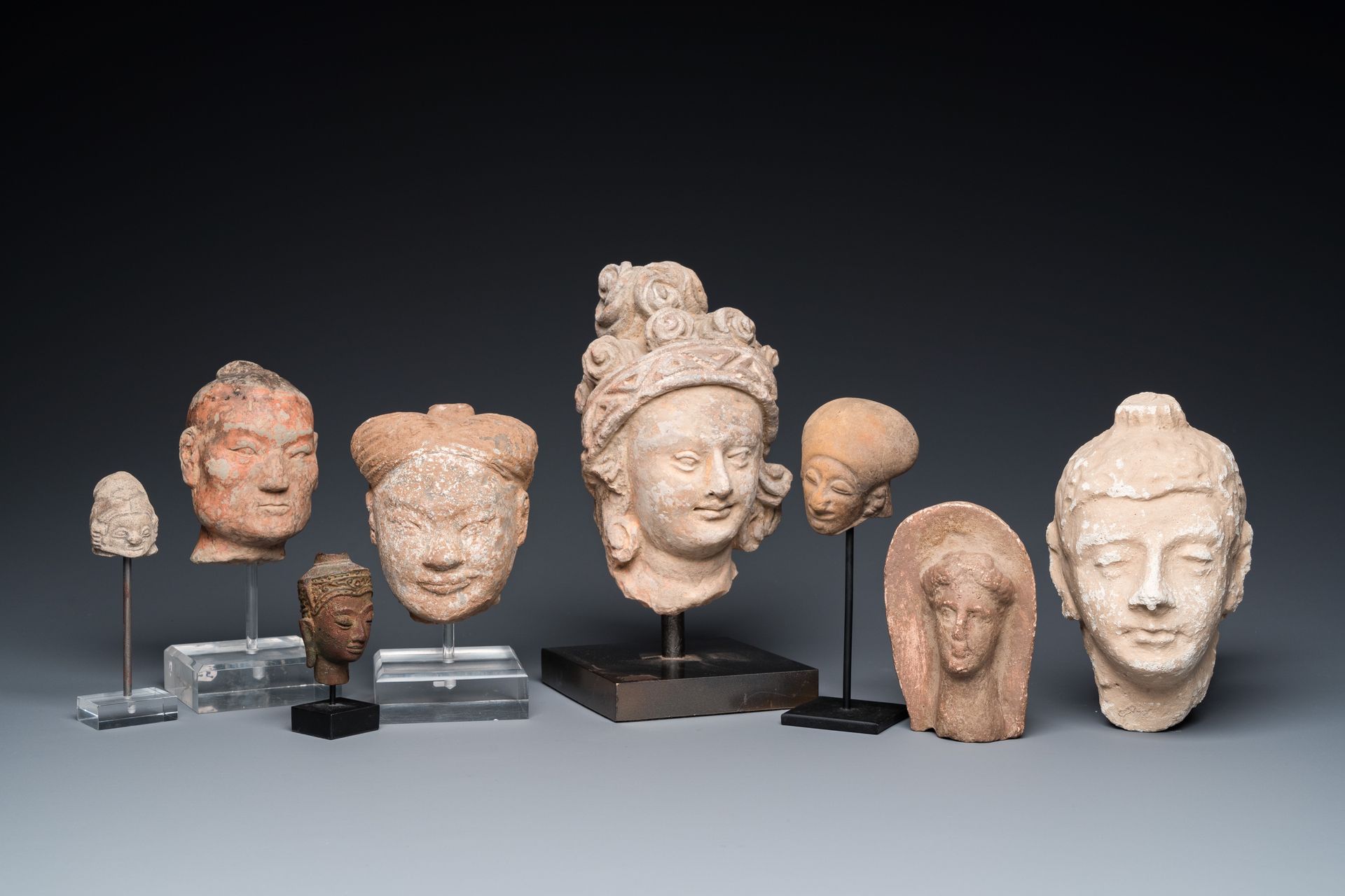 Eight various carved stone heads, incl. Chinese, Etruscan, Gandhara and Japanese&hellip;