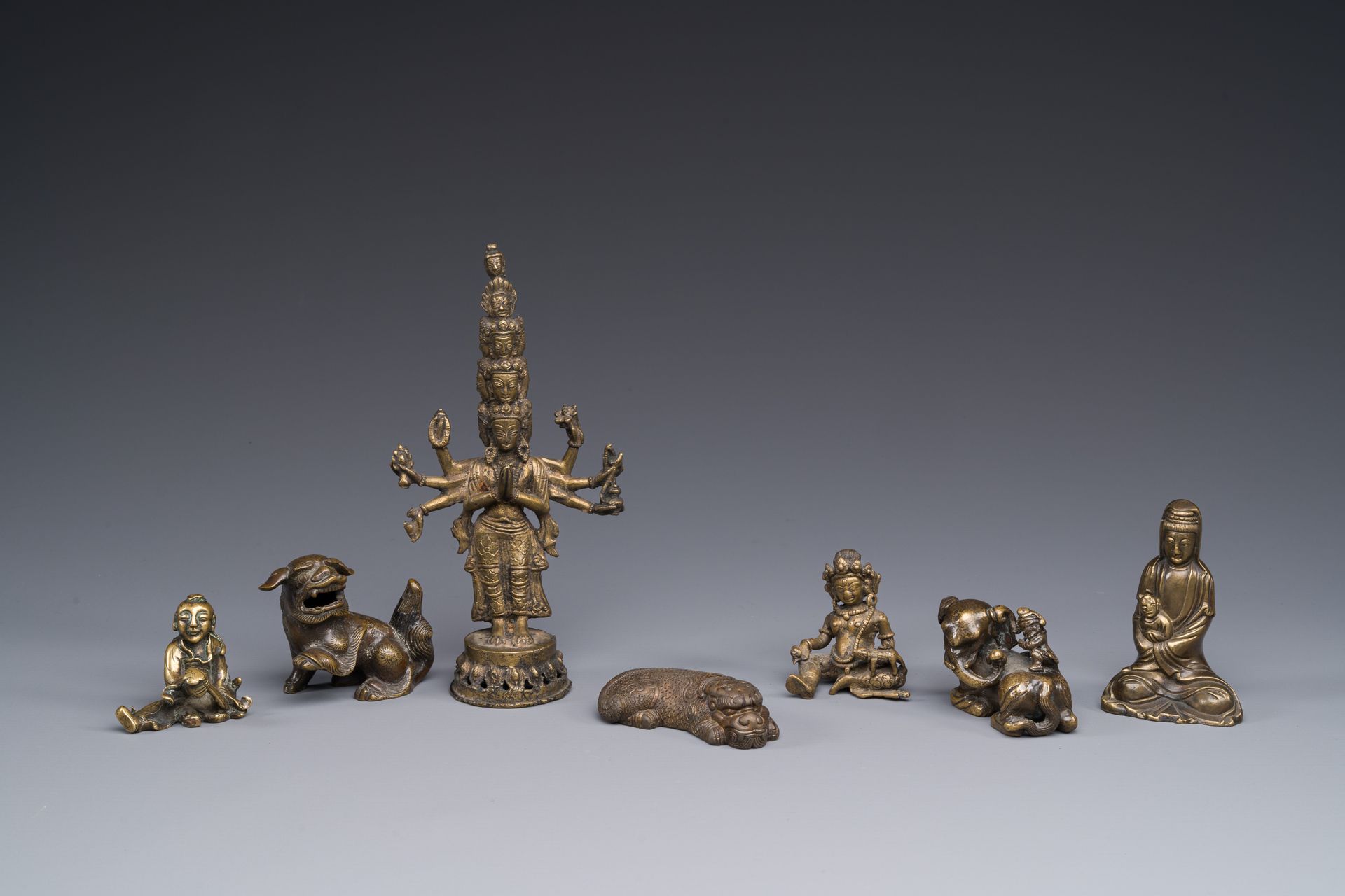A collection of Chinese and Sino-tibetan bronze sculptures and paper weights, Qi&hellip;