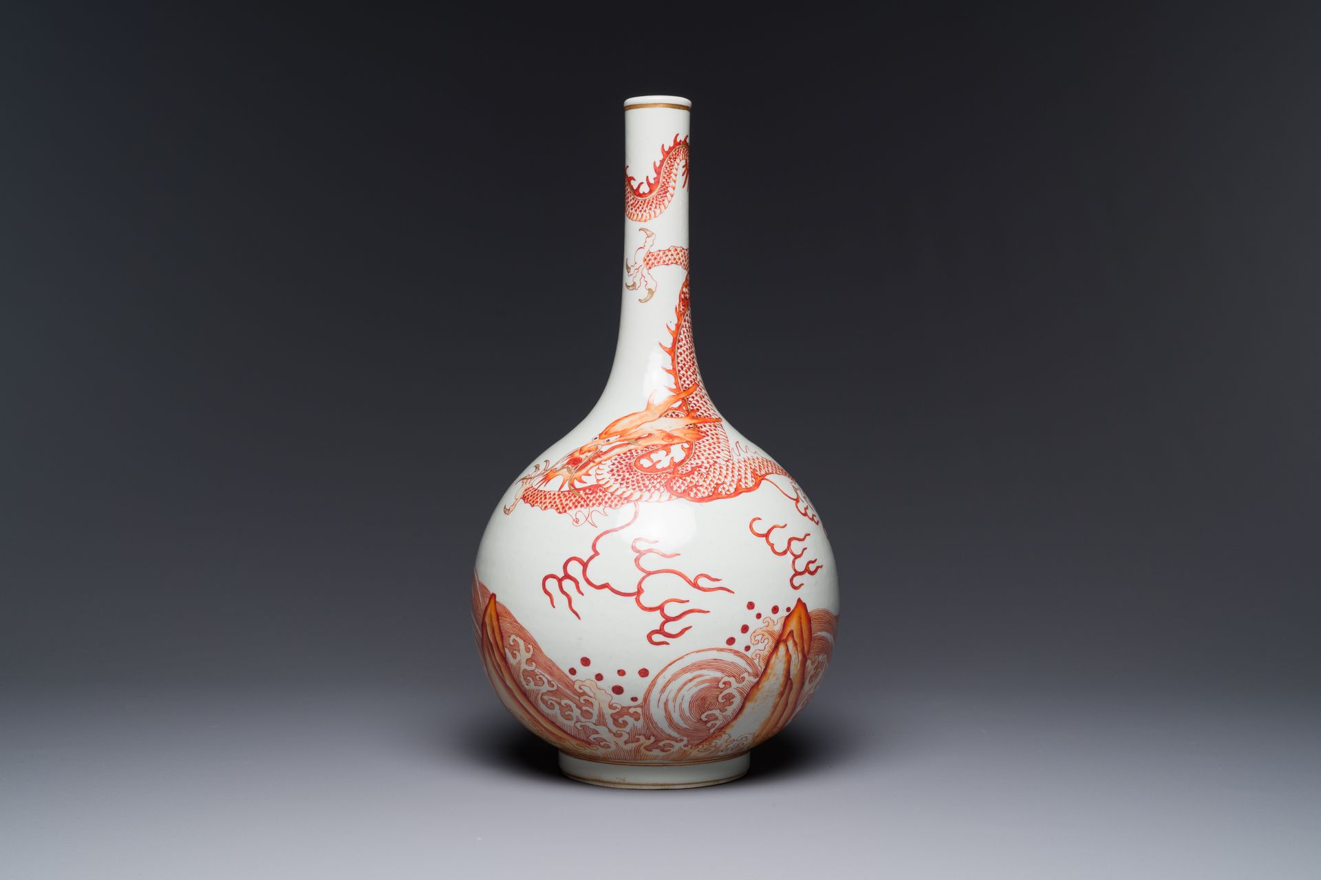 A Chinese iron-red-decorated and gilded 'dragon and carp' bottle vase, 19/20th C&hellip;