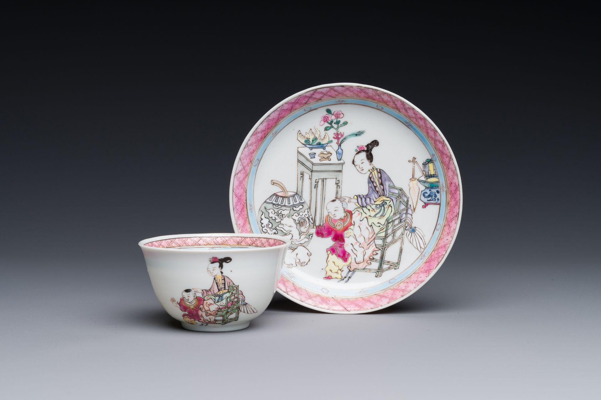 A Chinese famille rose cup and saucer with a court lady and a boy, Yongzheng Tas&hellip;