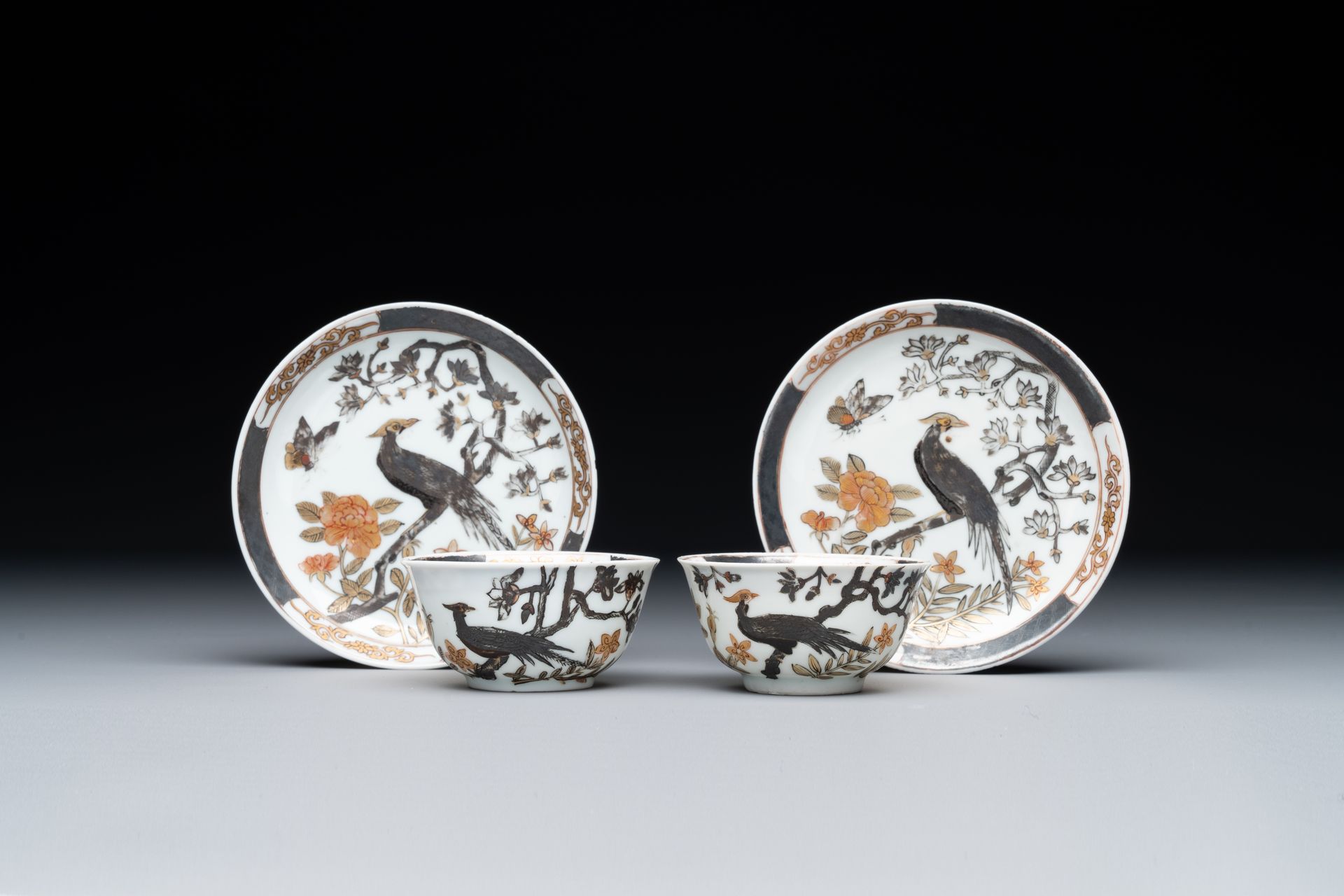 A pair of Chinese grisaille and gilded 'pheasant' cups and saucers, Yongzheng Pa&hellip;