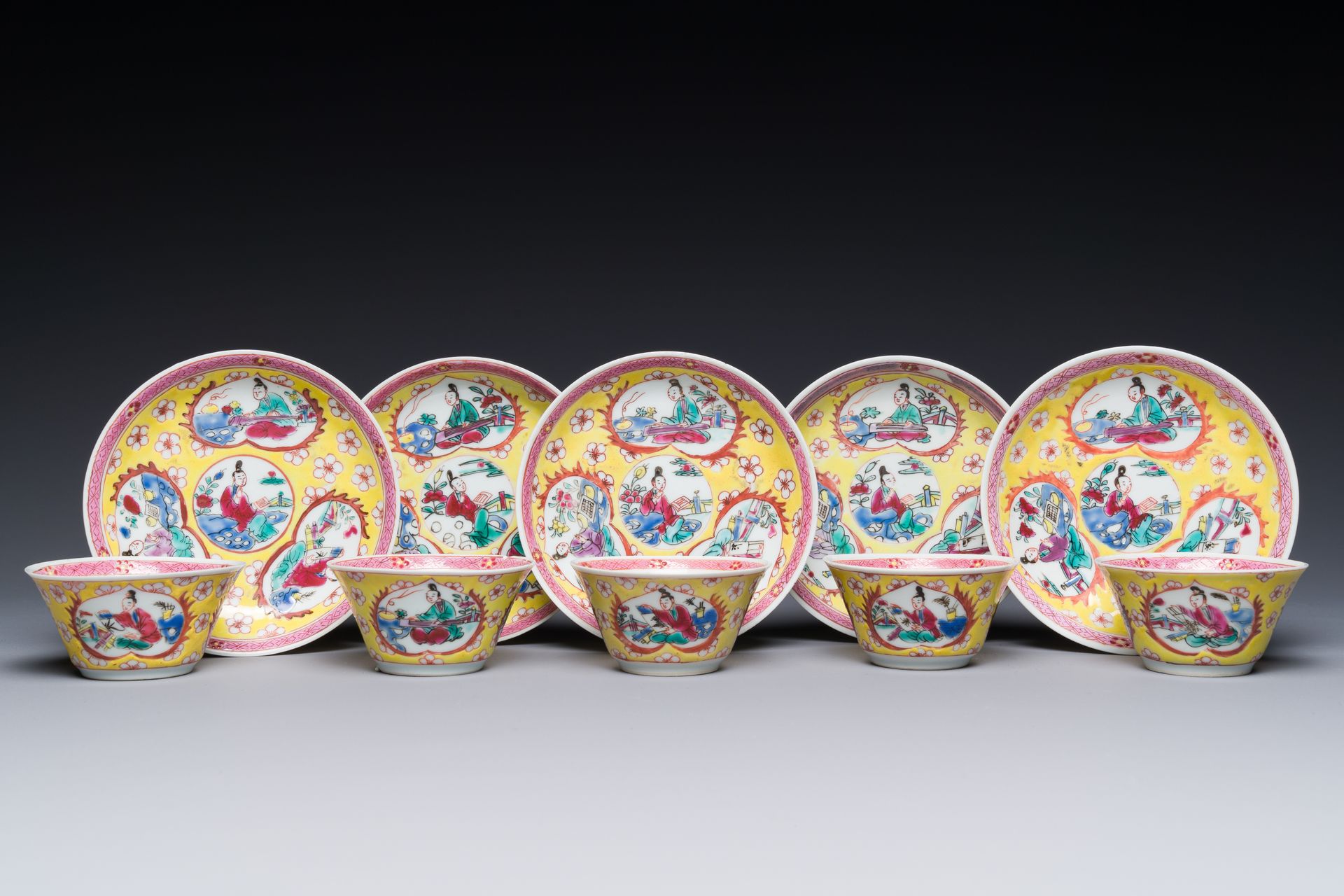 Five Chinese famille rose yellow-ground cups and saucers with 'four arts 四藝' dec&hellip;