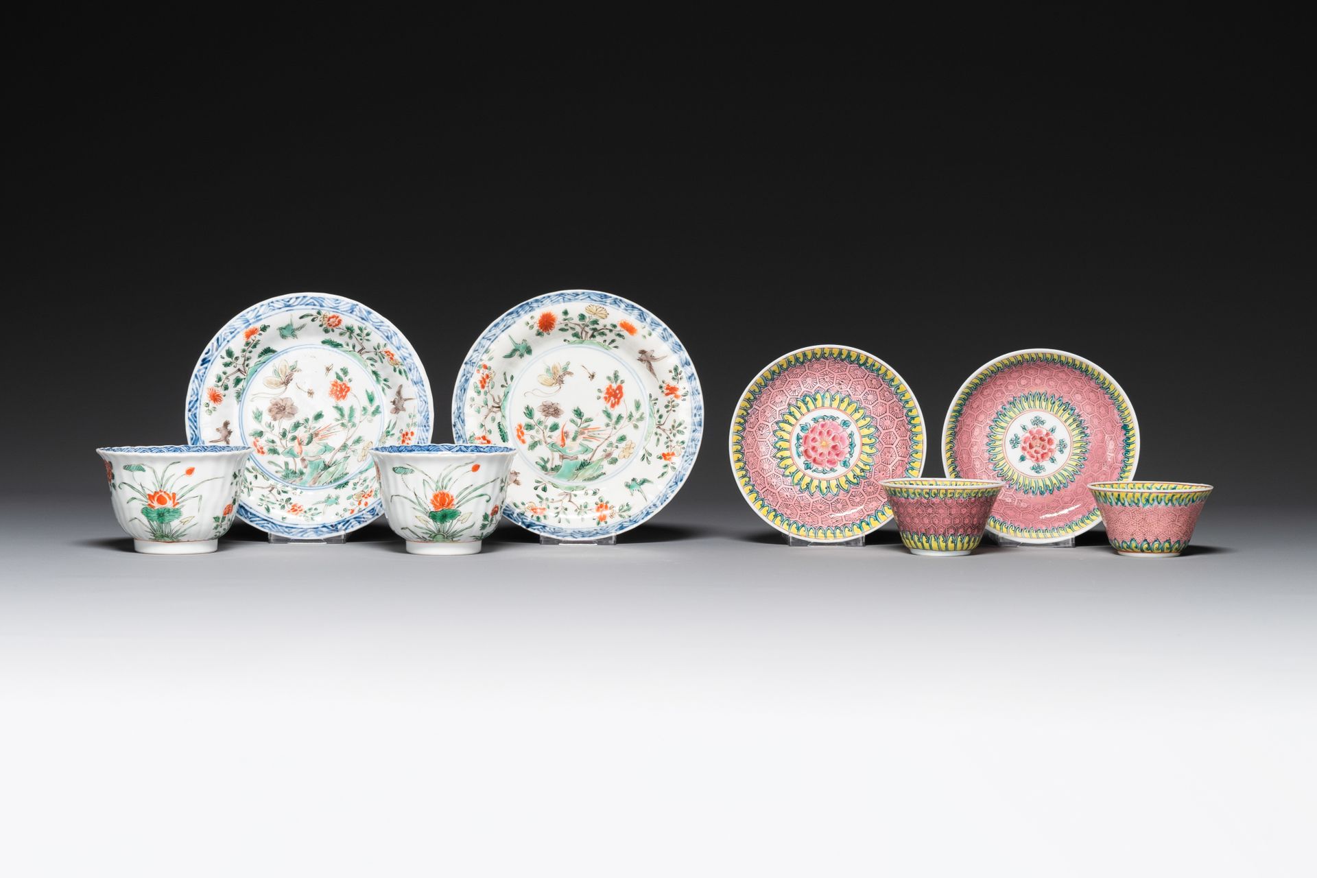 A pair of Chinese famille verte and a pair of famille rose cups and saucers, Kan&hellip;
