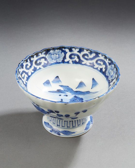 CHINE Porcelain bowl on foot decorated in blue underglaze with scrolls and mount&hellip;