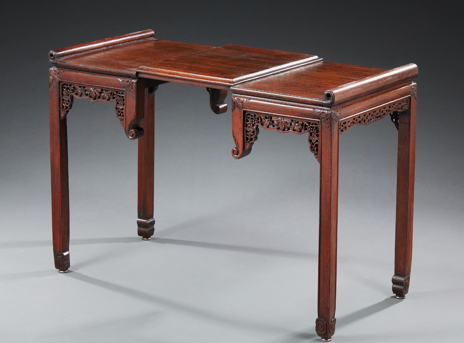 CHINE Carved fruitwood console. The top has scrolls and openwork garlands.
About&hellip;