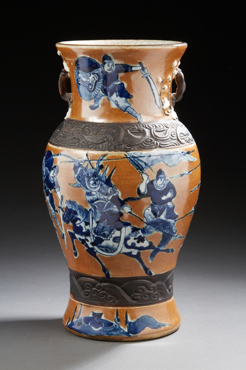 CHINE (NANKIN) A brown porcelain baluster vase decorated in blue with horsemen a&hellip;