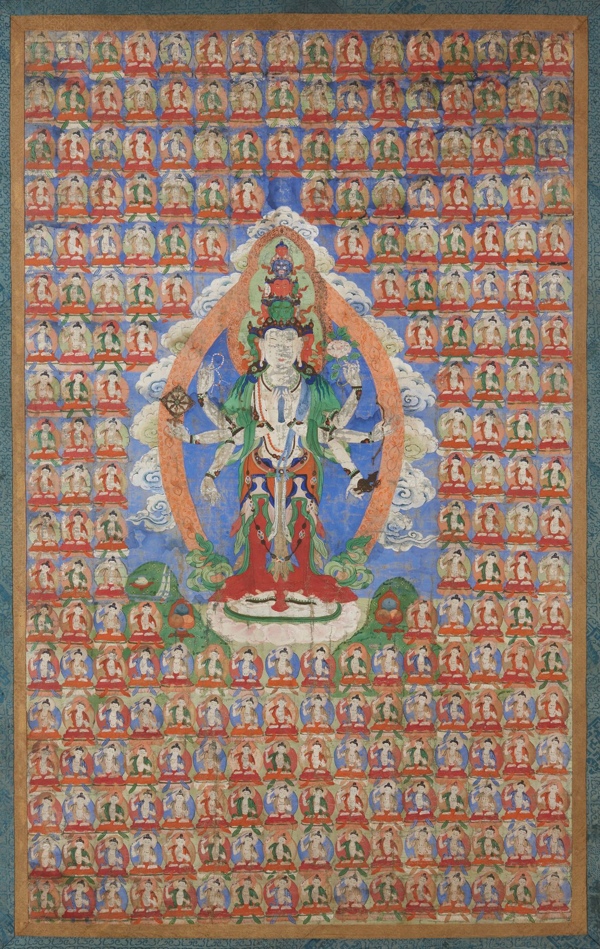 TIBET 
19世纪
尺寸：102 x 62厘米（目测）（磨损和小部分缺失），表现观音菩萨站在许多坐着的菩萨中间。