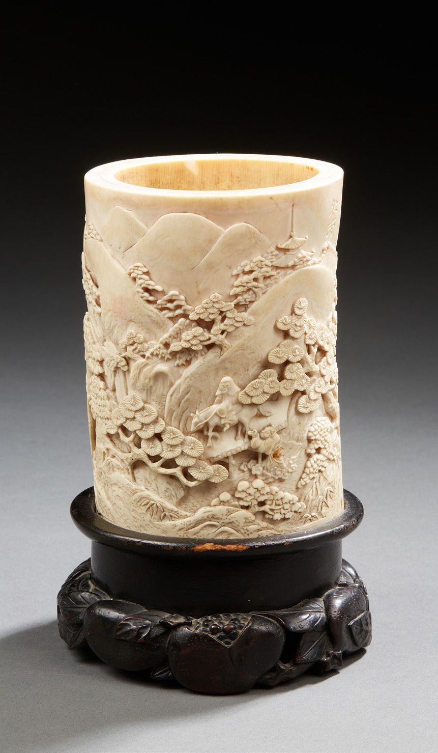 CHINE A finely carved ivory brush holder with a motif of animated scenes in moun&hellip;