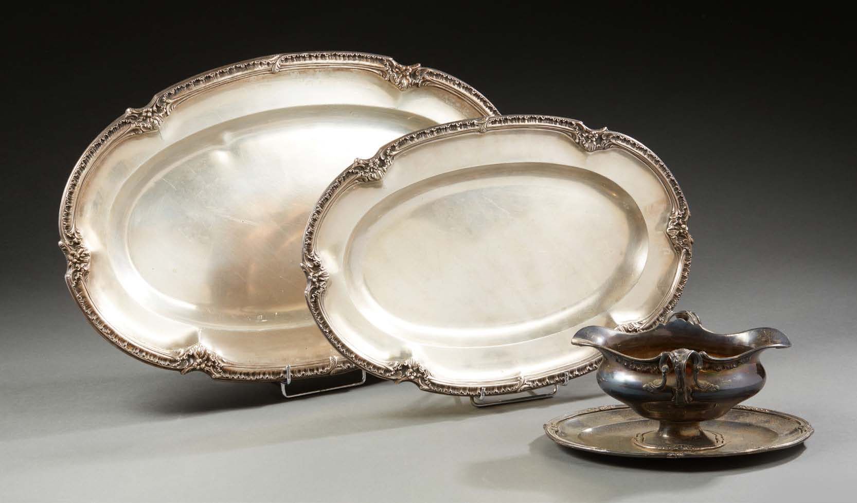 Null SET of two silver dishes and a sauceboat, the edges decorated with foliage &hellip;