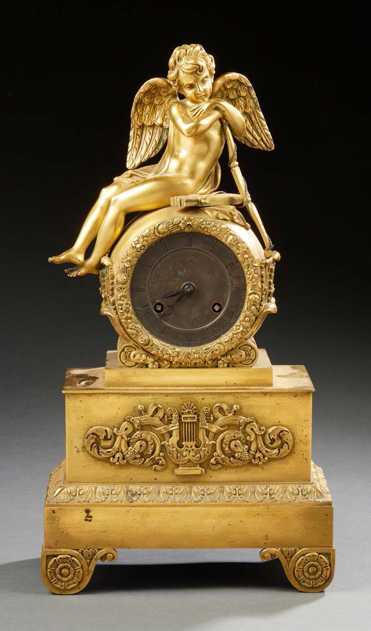 Null A chased and gilded bronze CLOCK; the damping decorated with Cupid resting;&hellip;
