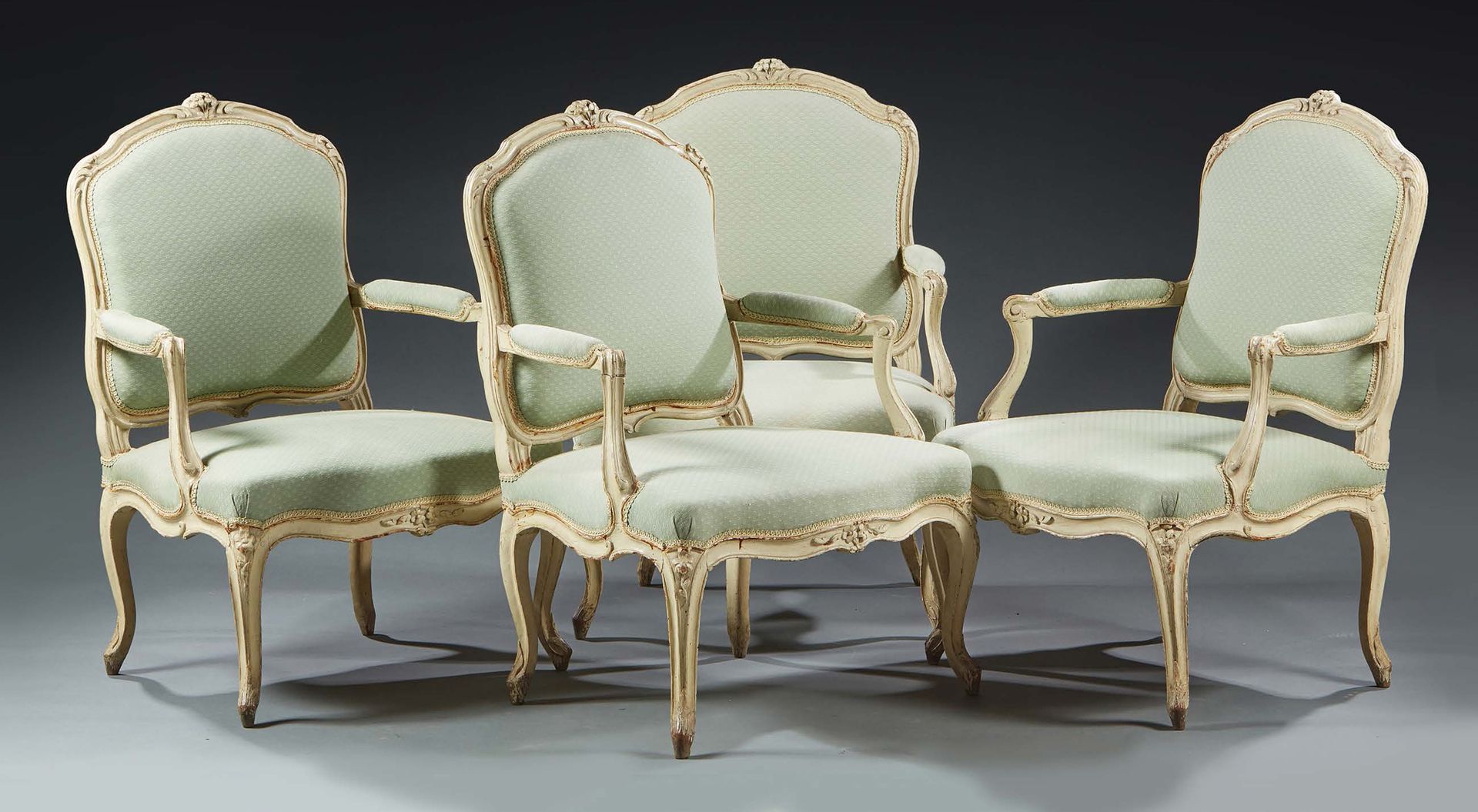Null SUITE OF FOUR FLAT-BACKED ARMCHAIRS in moulded, carved and cream lacquered &hellip;