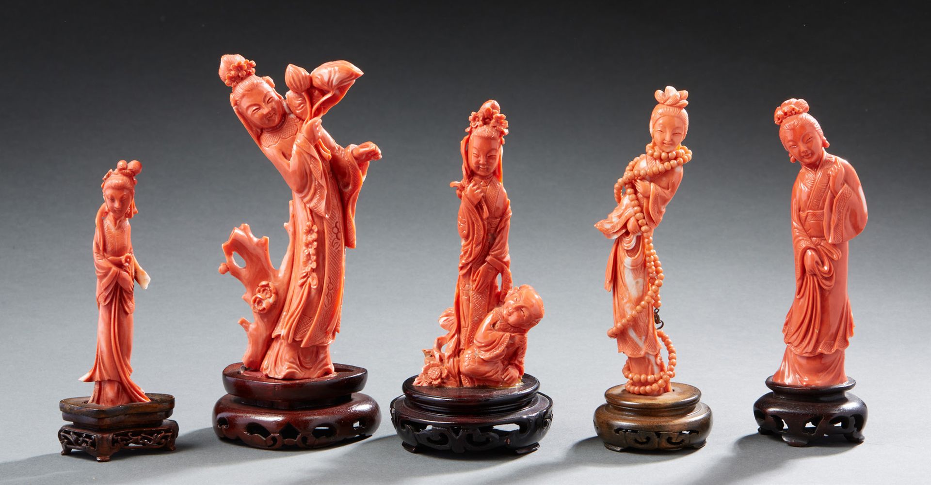 CHINE Five carved light coral figurines representing female characters and guany&hellip;