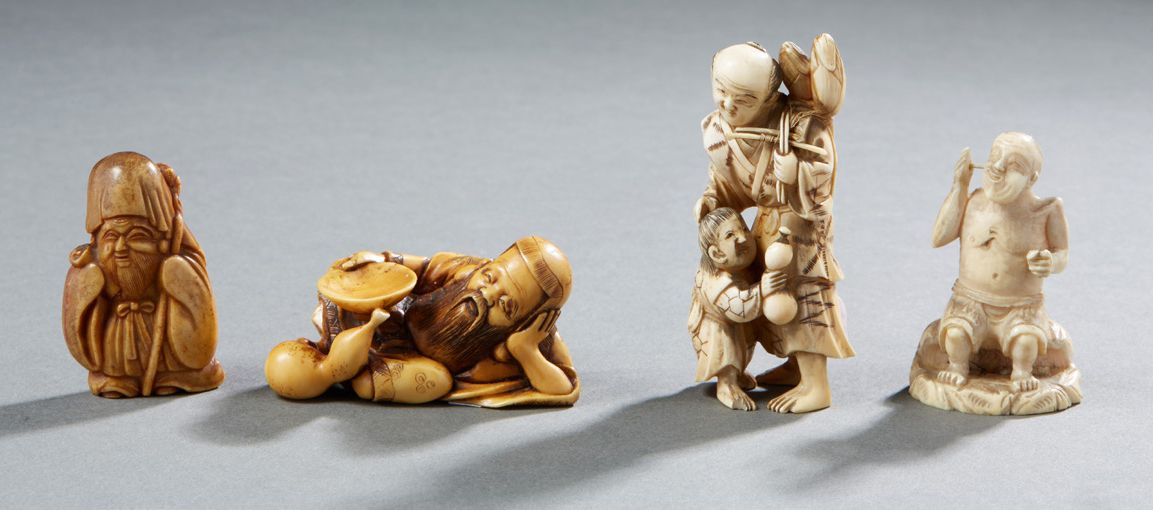 JAPON Four netsuke representing different characters in carved bone First third &hellip;