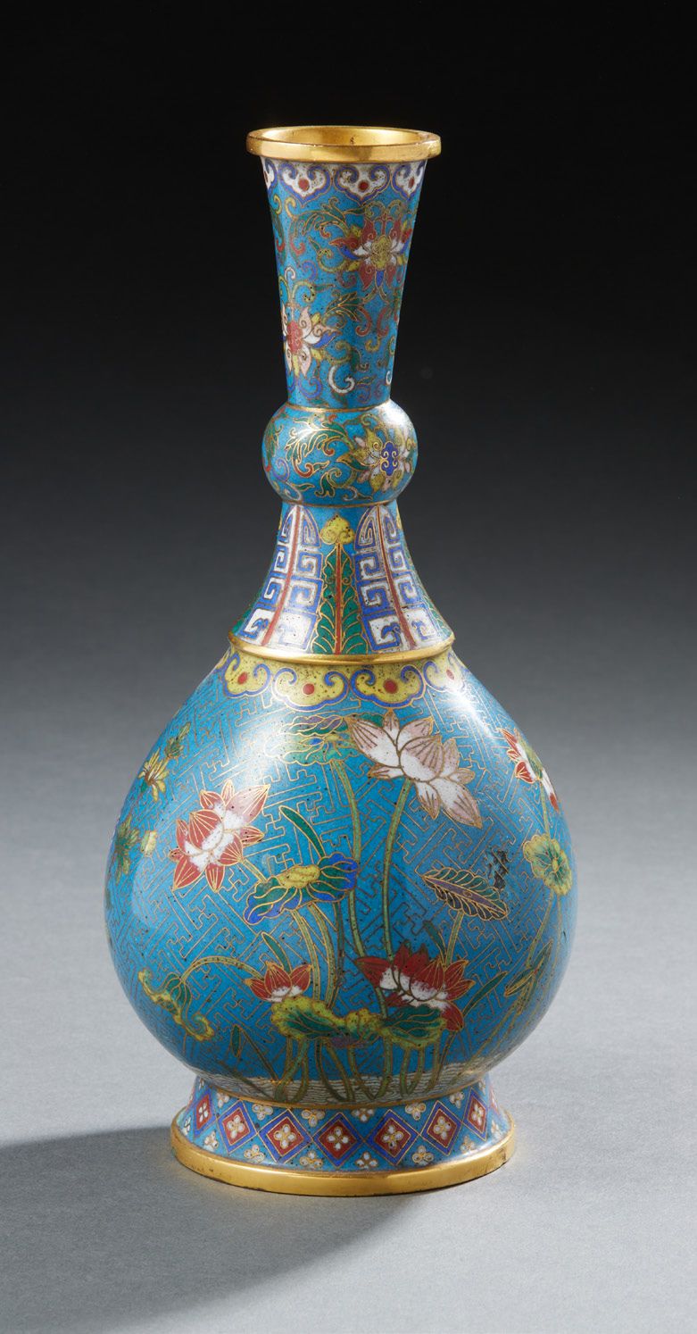 CHINE A cloisonné bronze vase with a long narrow neck and a turquoise background&hellip;