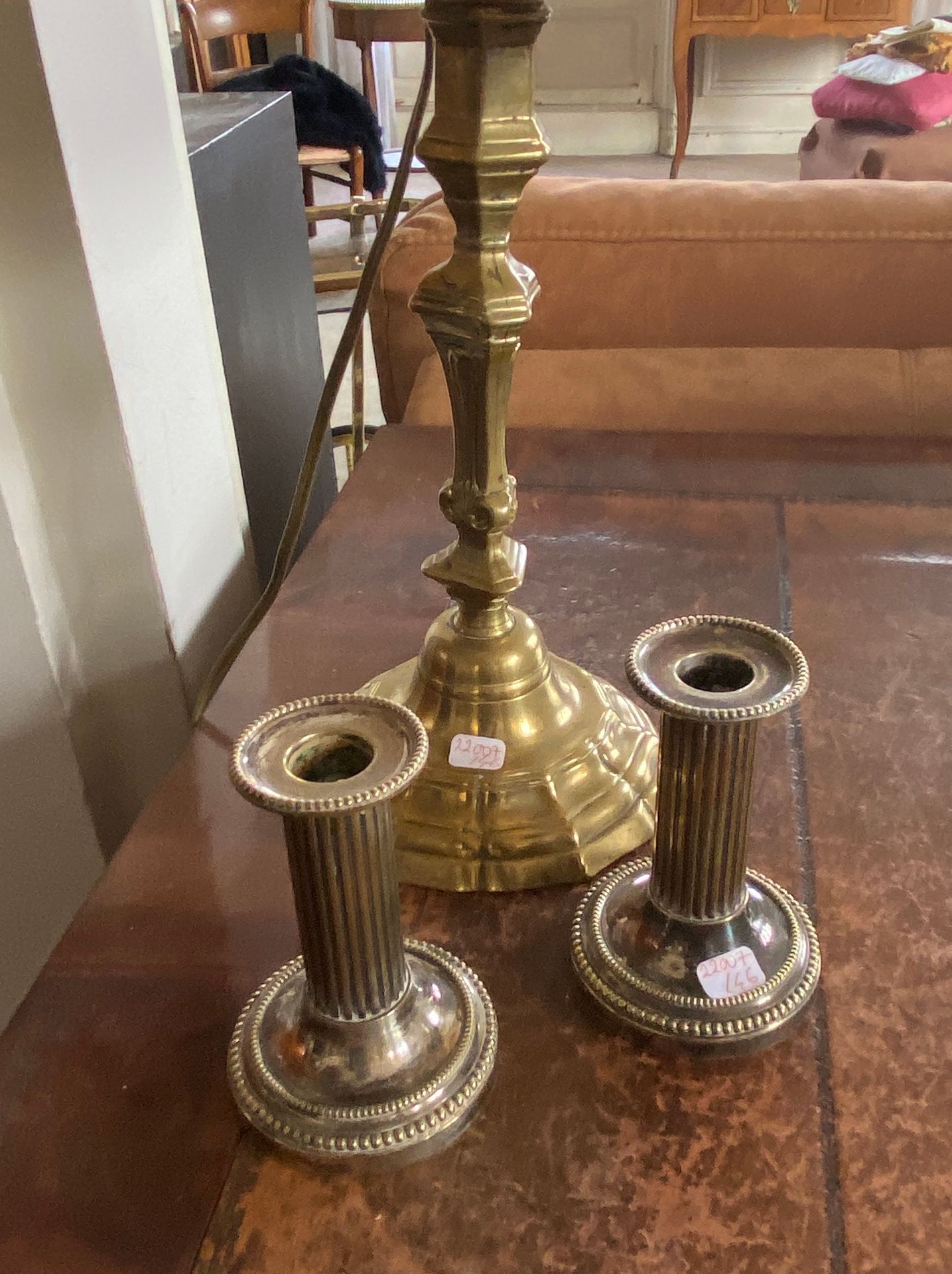 Null Lot including a brass lamp stand and two silver plated candle holders.

(sa&hellip;