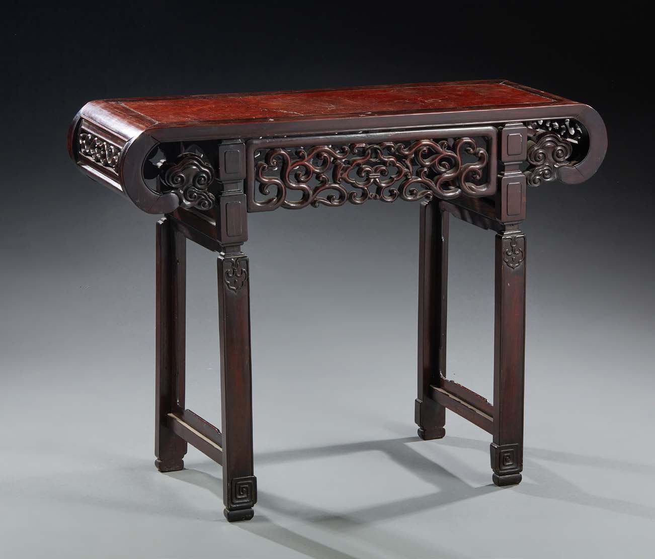 CHINE - XXe siècle Console of middle in exotic wood, the tray with scrolls, deco&hellip;