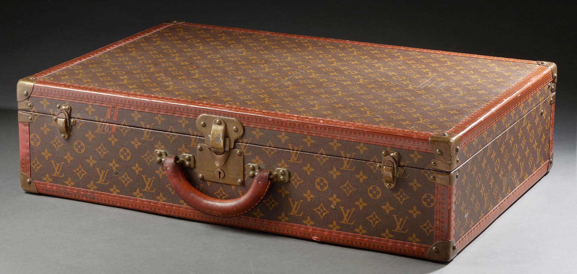 LOUIS VUITTON Bisten suitcase in monogrammed canvas, brass clasps, lozenge edges&hellip;