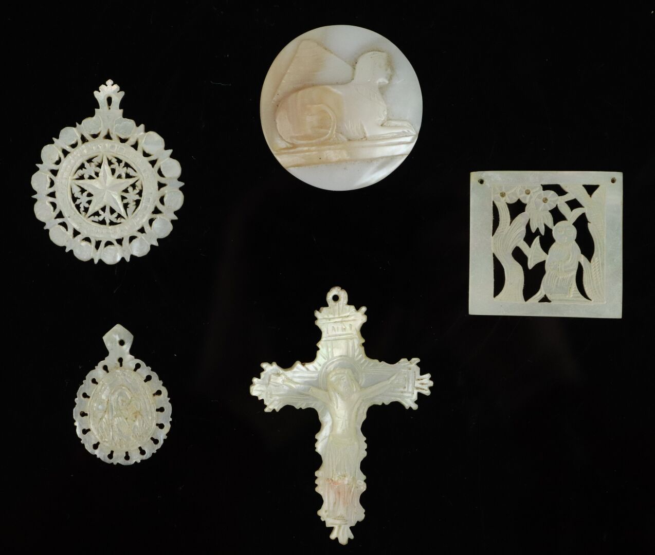 Null Set of mother-of-pearl carved plates and pendants, some openwork.

It inclu&hellip;