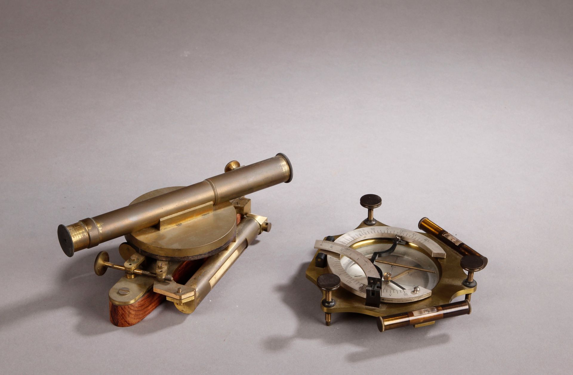 Null Set of two surveying instruments: 1 large brass compass with alidade and 2 &hellip;