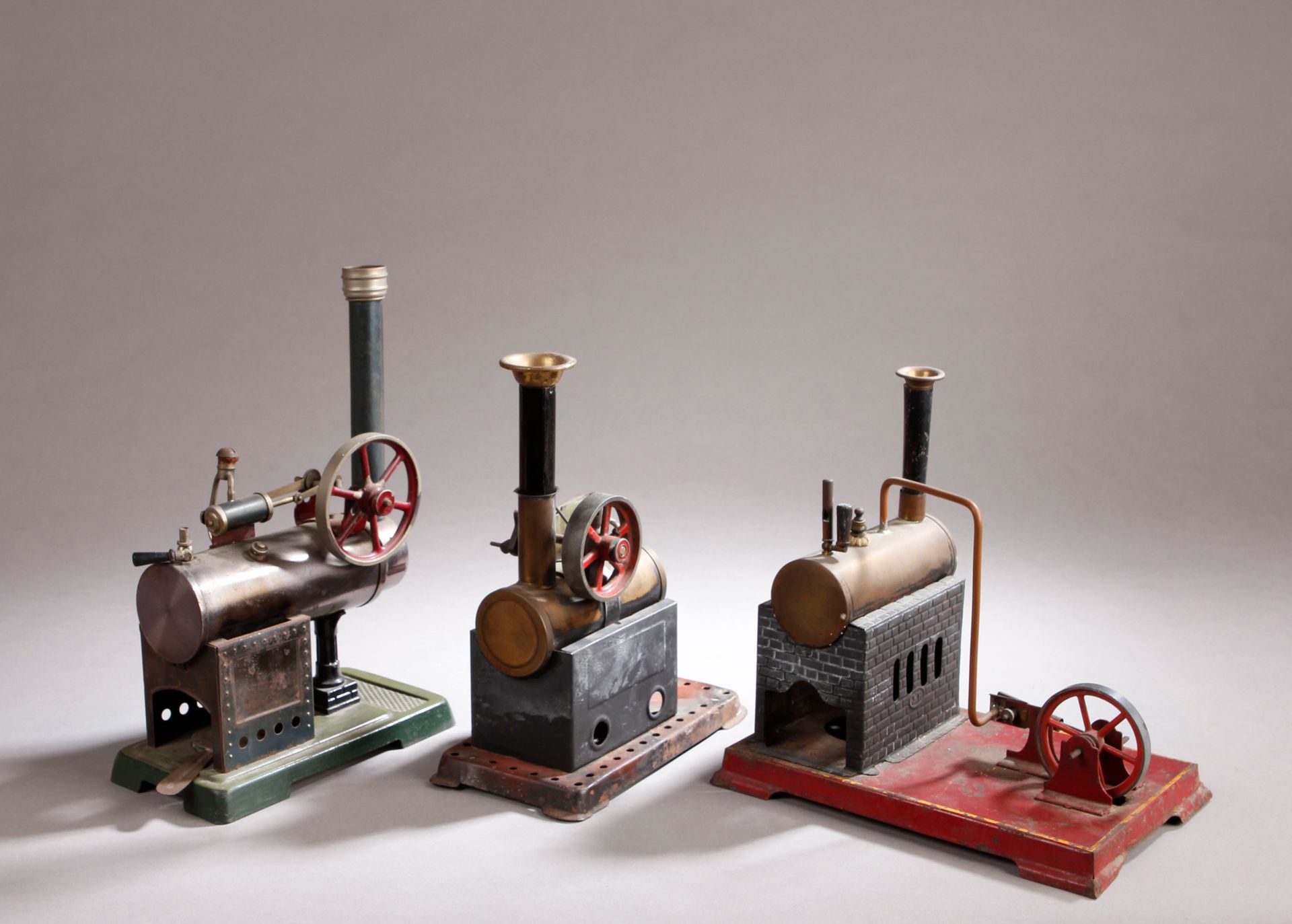 Null Three semi-fixed steam engines with horizontal tank, chimney and burner. On&hellip;