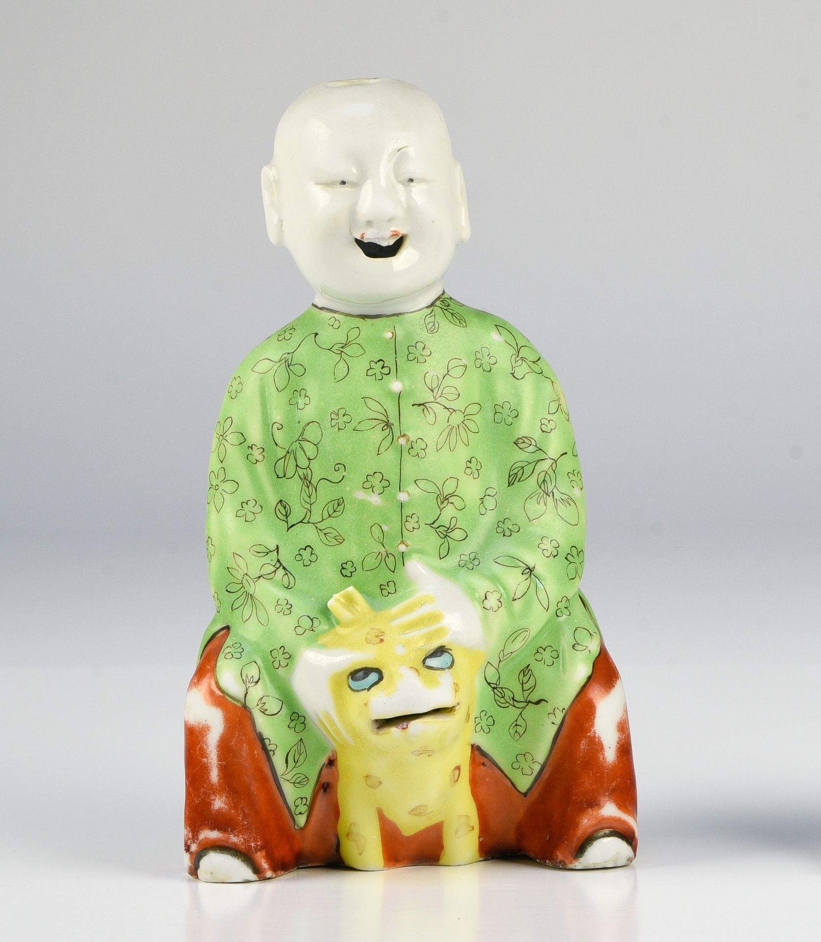 Null Statuette of a smiling child seated on a tiger

CHINA - JIAQING ERA (1796-1&hellip;