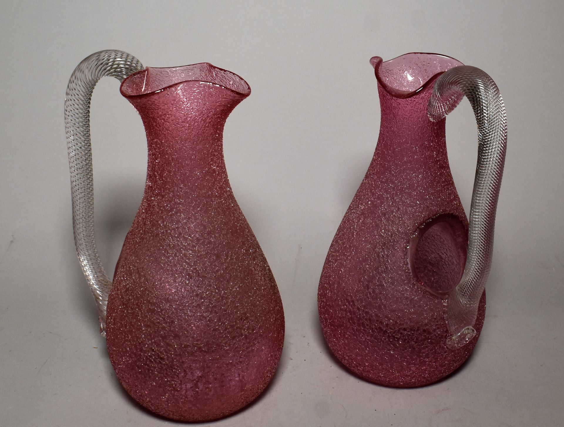 Null Pair of orangeade carafes in pink granite glass, twisted handle. Height 27 &hellip;