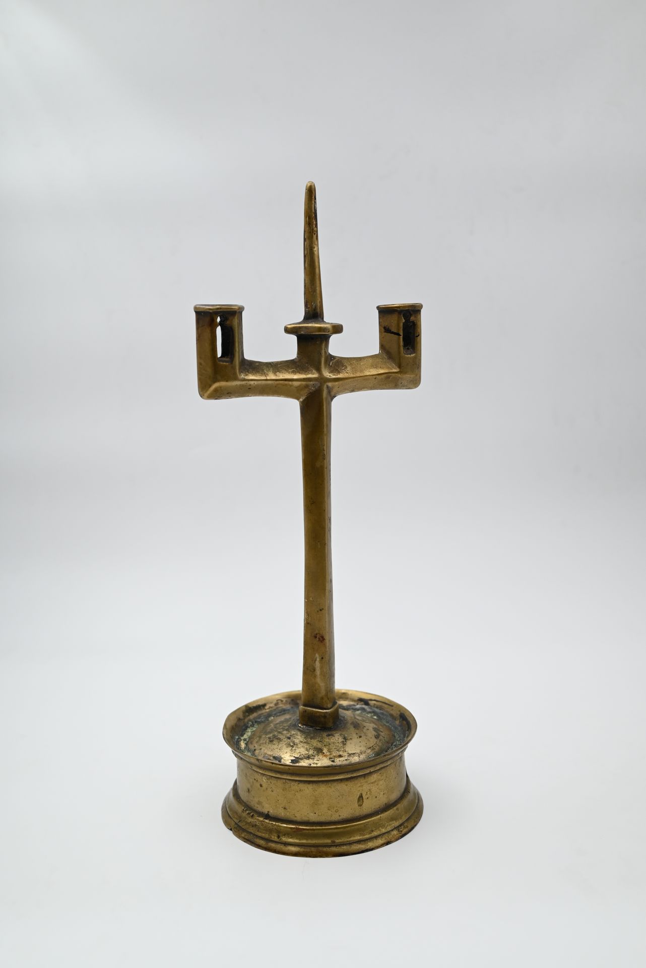 Null A brass candlestick with two arms of light, cylindrical base (restorations)&hellip;