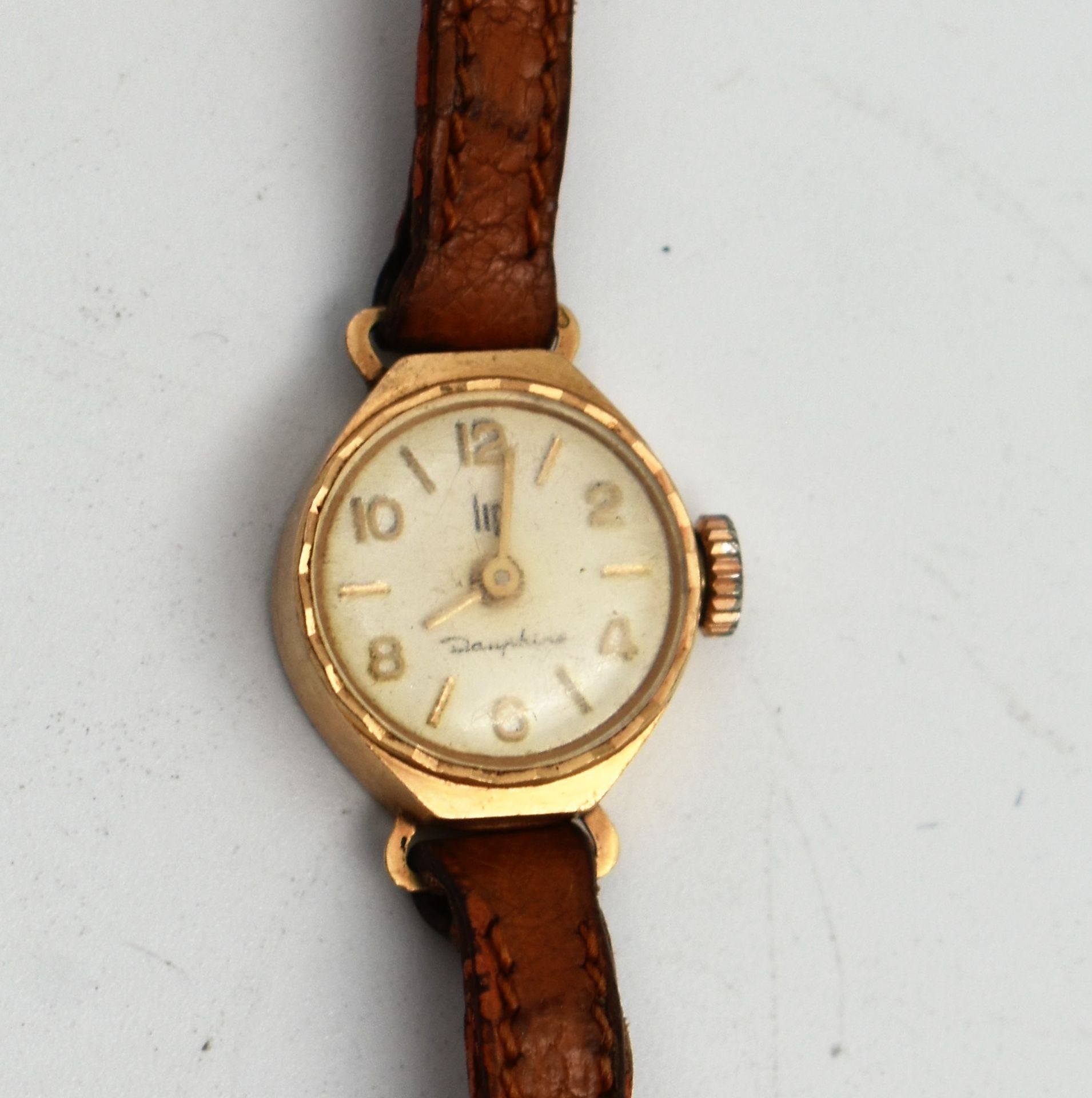Null LIP Dauphine: Lady's wristwatch, gold case, leather strap. Gross weight 16.&hellip;