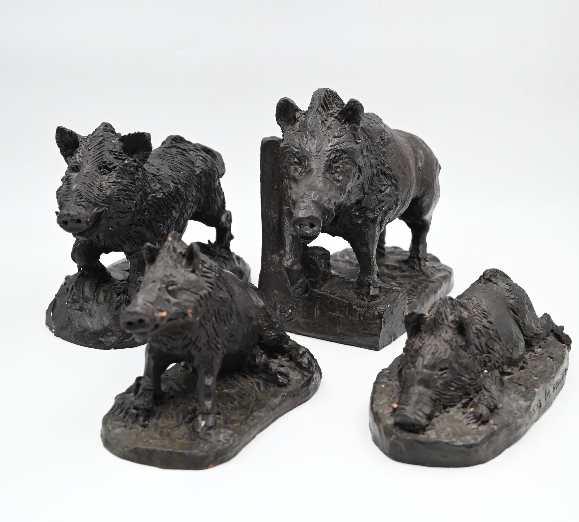 Null FOUR boar subjects modeled in plaster or orange clay, bronze patina. Signed&hellip;