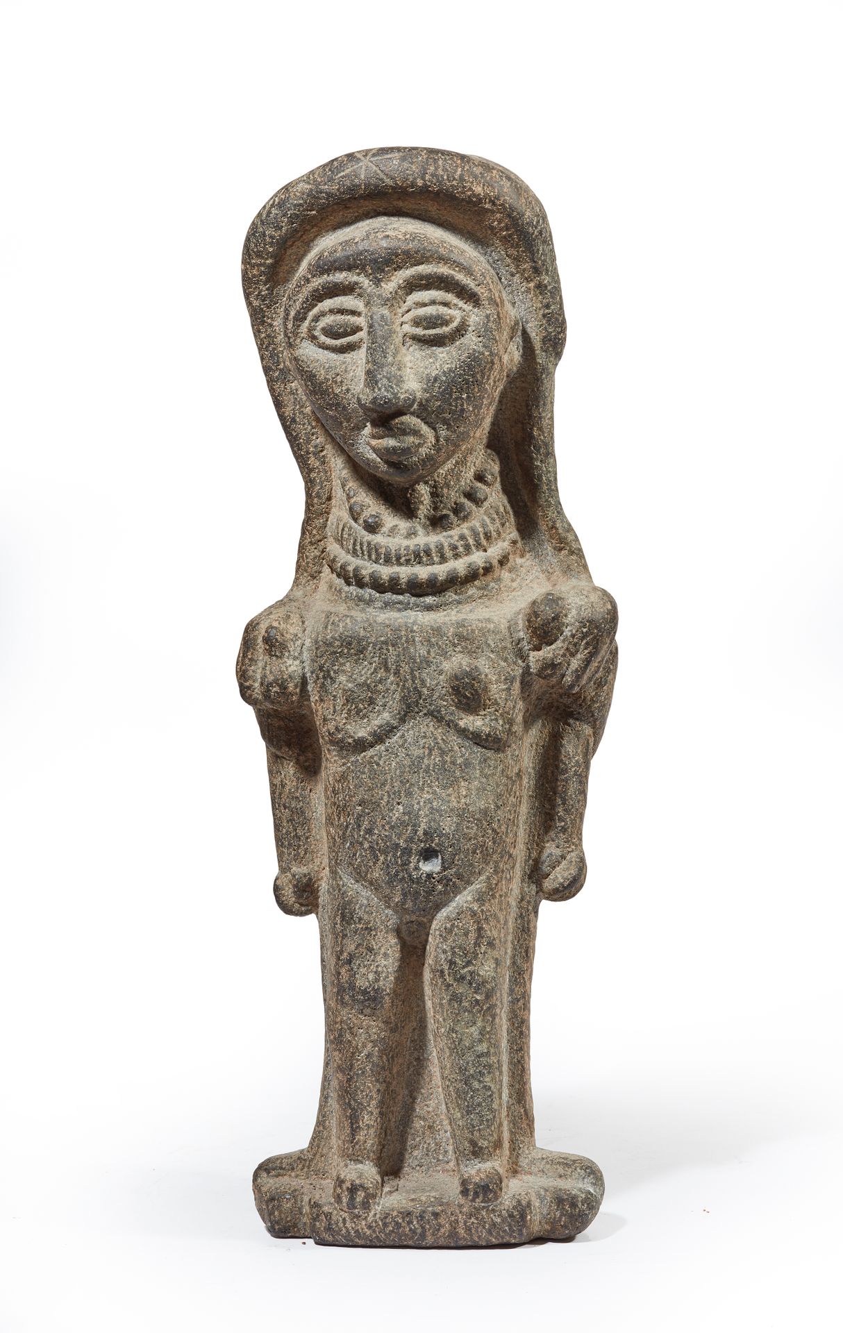 Null Statue in volcanic stone of a standing deity wearing a three-row necklace.
&hellip;