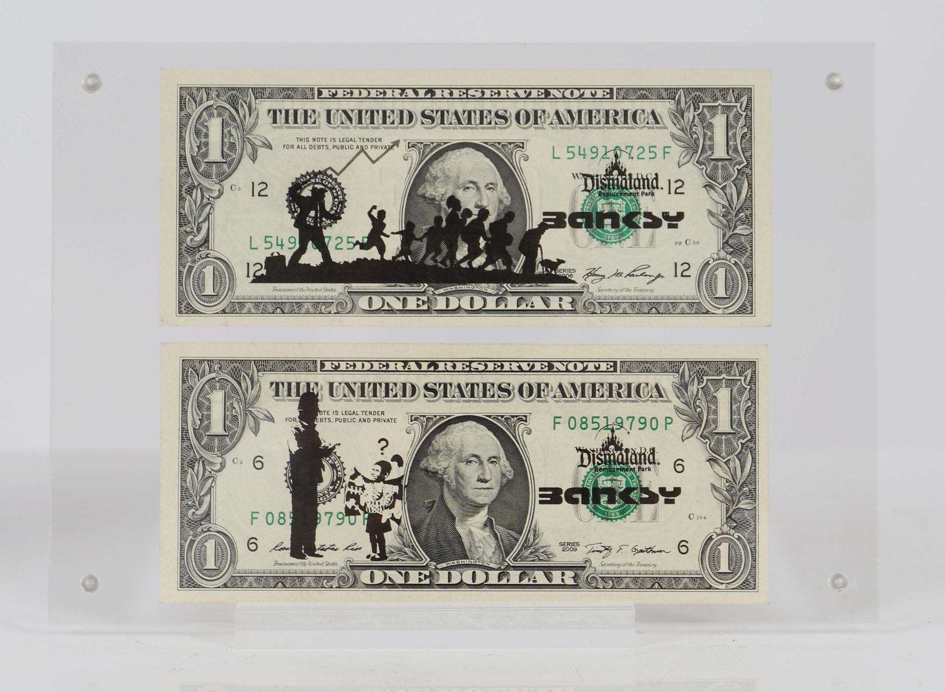 Null Banksy (after)

Set of two real US $1 bills, stencilled designs and signatu&hellip;