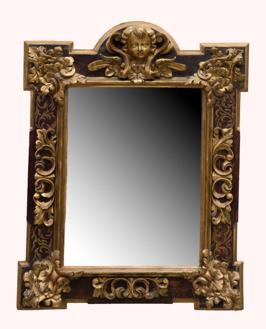 Null A lacquered wood and gilded wood mirror, decorated with foliage, the pedime&hellip;