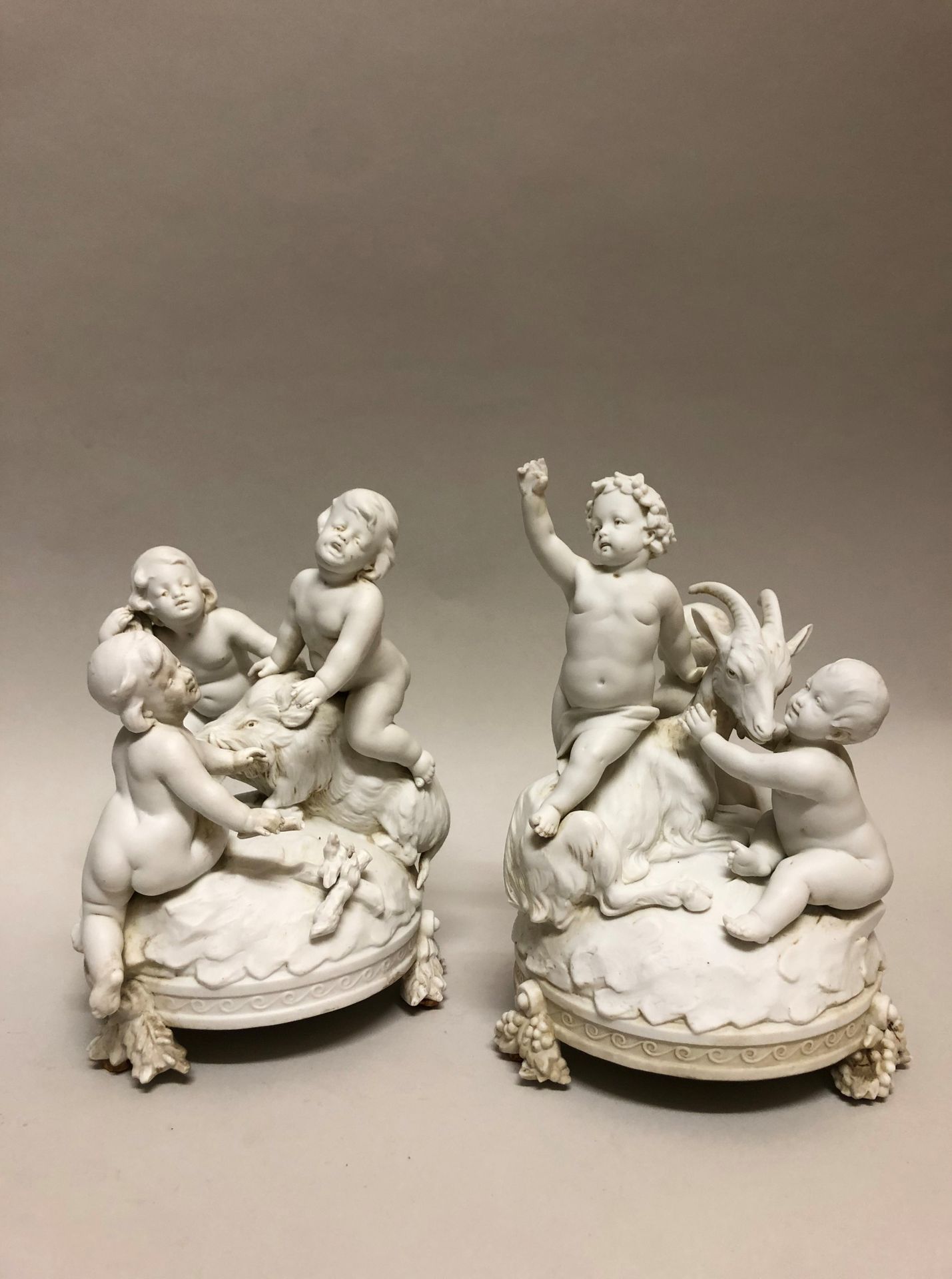 Null PAIR OF GROUPS in biscuit representing putti playing with a goat and a boar&hellip;