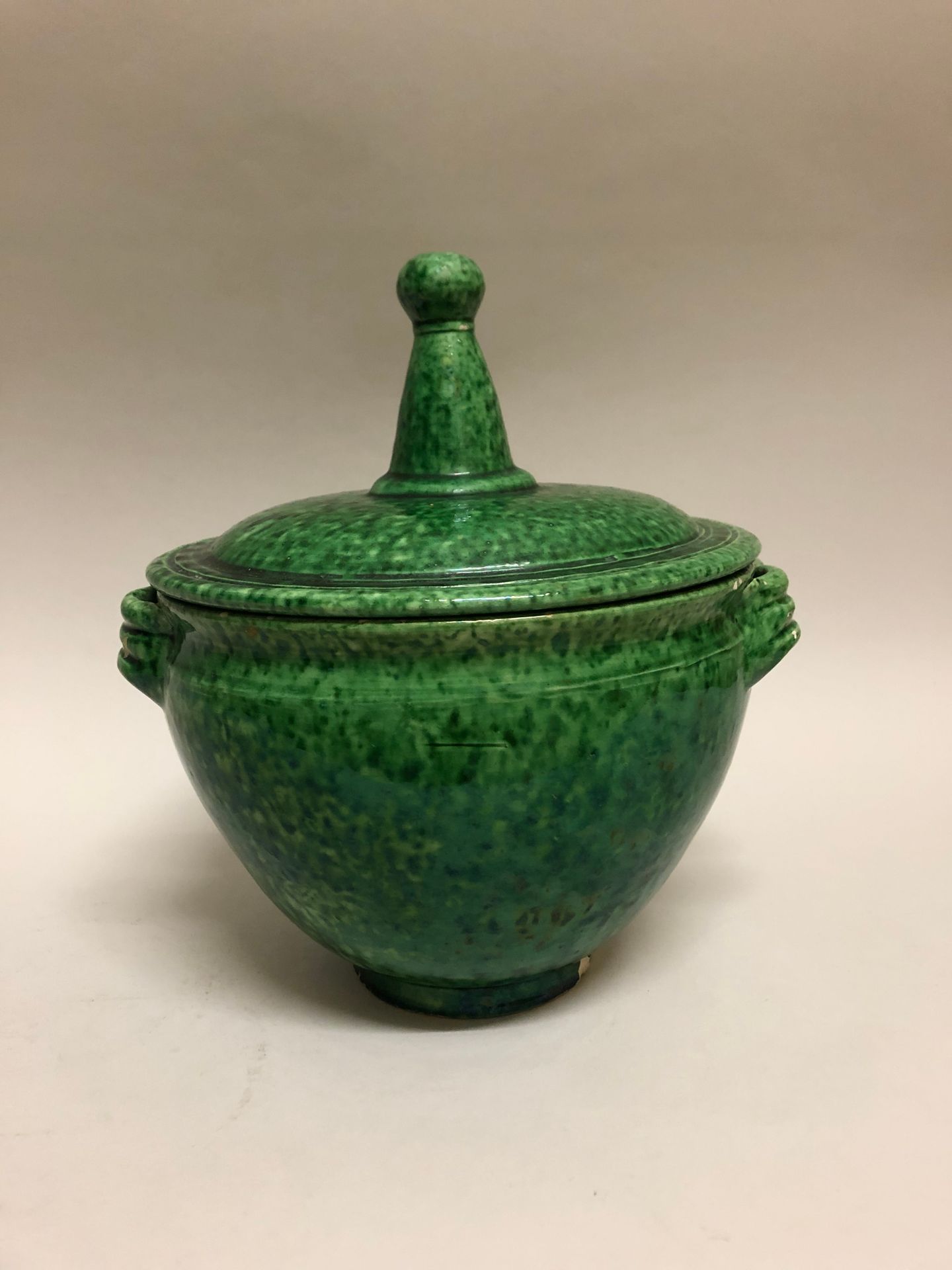 Null VALLAURIS. Covered pot in green glazed earthenware. Signed under the base. &hellip;
