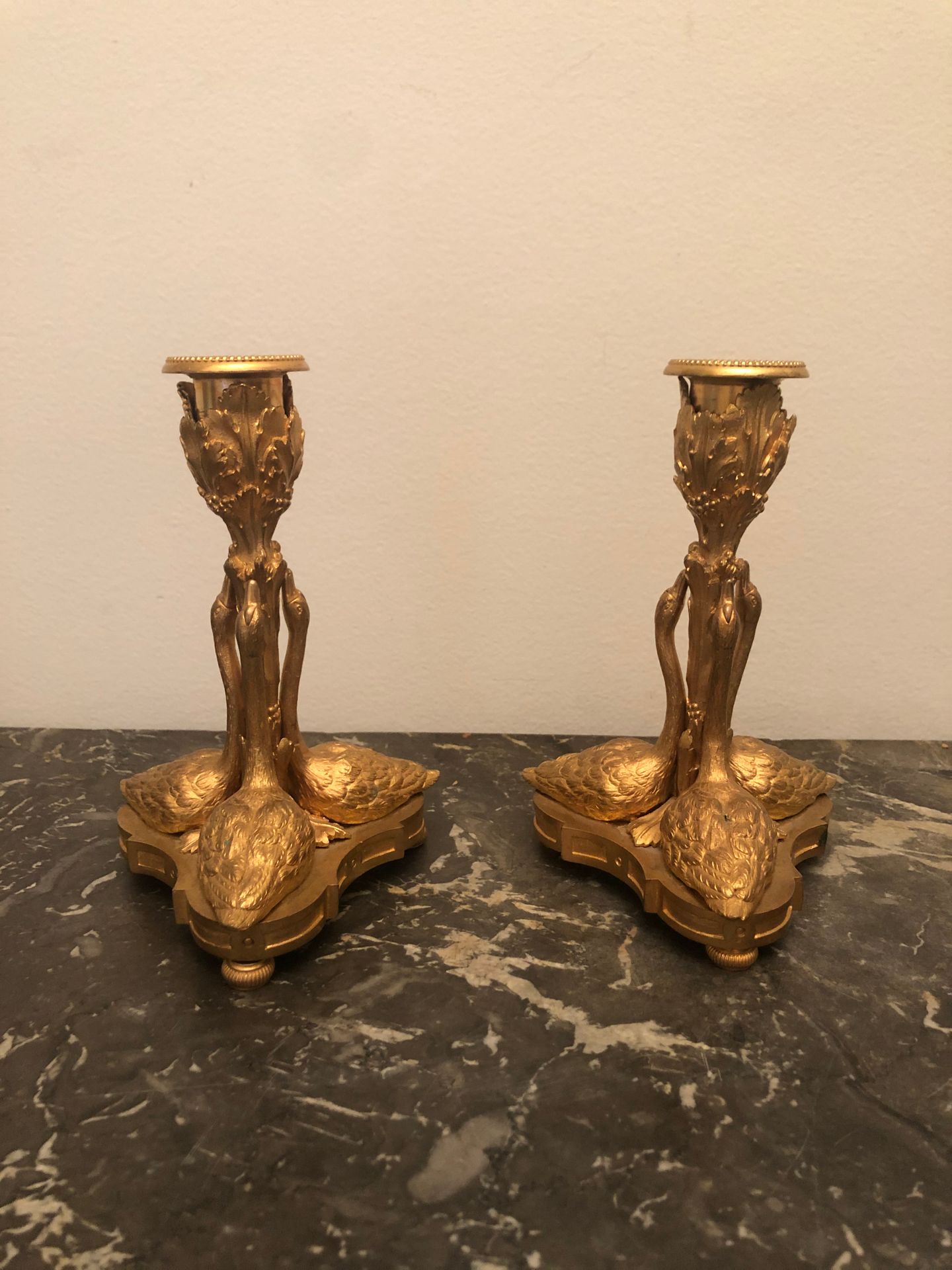 Null A pair of ormolu CANDLES with a shaft surrounded by three swans. In the 18t&hellip;