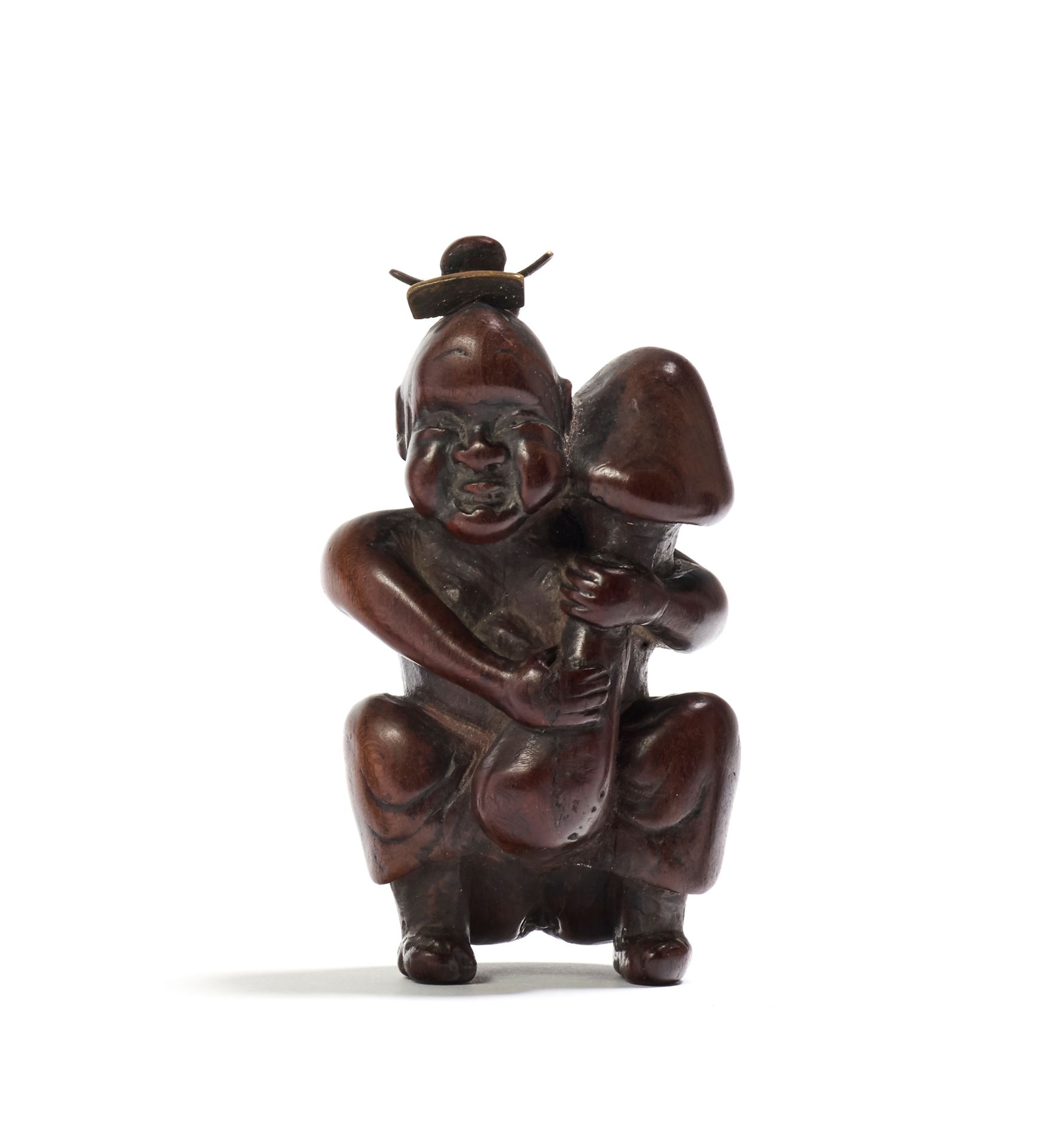 JAPON - XIXE SIÈCLE Boxwood shunga netsuke, Okame seated, dress raised to reveal&hellip;